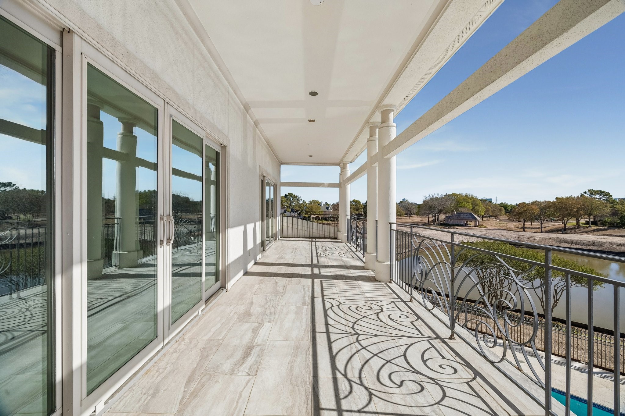 PRIVATE BALCONY FOR ENSUITE BEDROOMS 2 AND 3 - RELAX AND ENJOY THE VIEWS - overlooking the pool/spa, lake and golf course