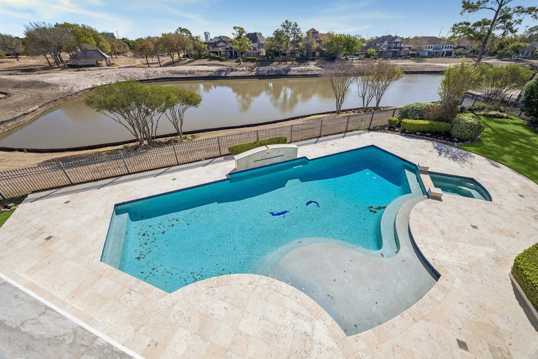 POOL/SPA VIEWED FROM 2ND FLOOR BALCONY - plus a beautiful view of the lake and surrounding fairways of the Royal Oaks Country Club golf course
