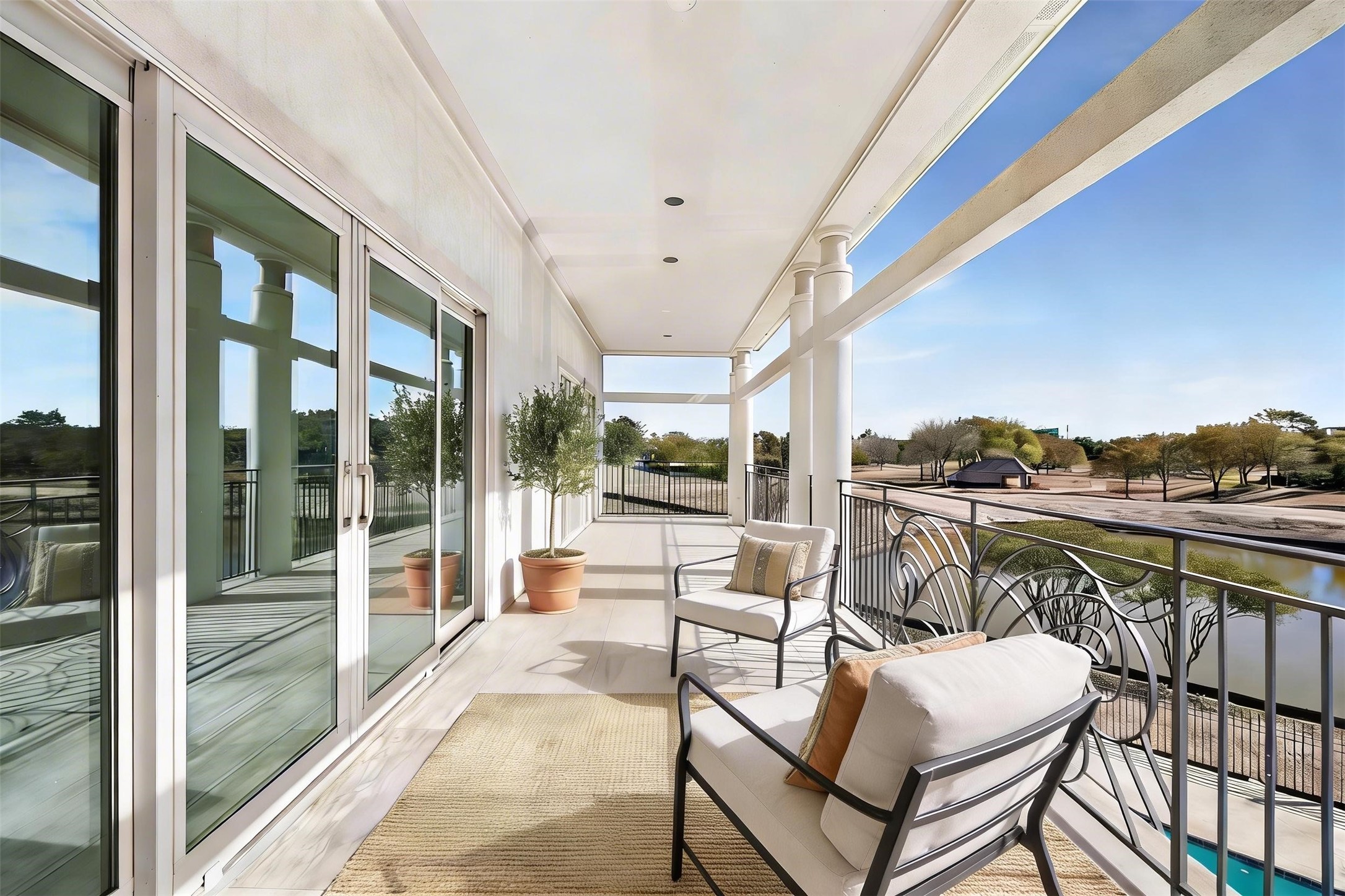 VIRTUALLY STAGED - private balcony for bedrooms 2 and 3 - seating provided to relax and enjoy the views