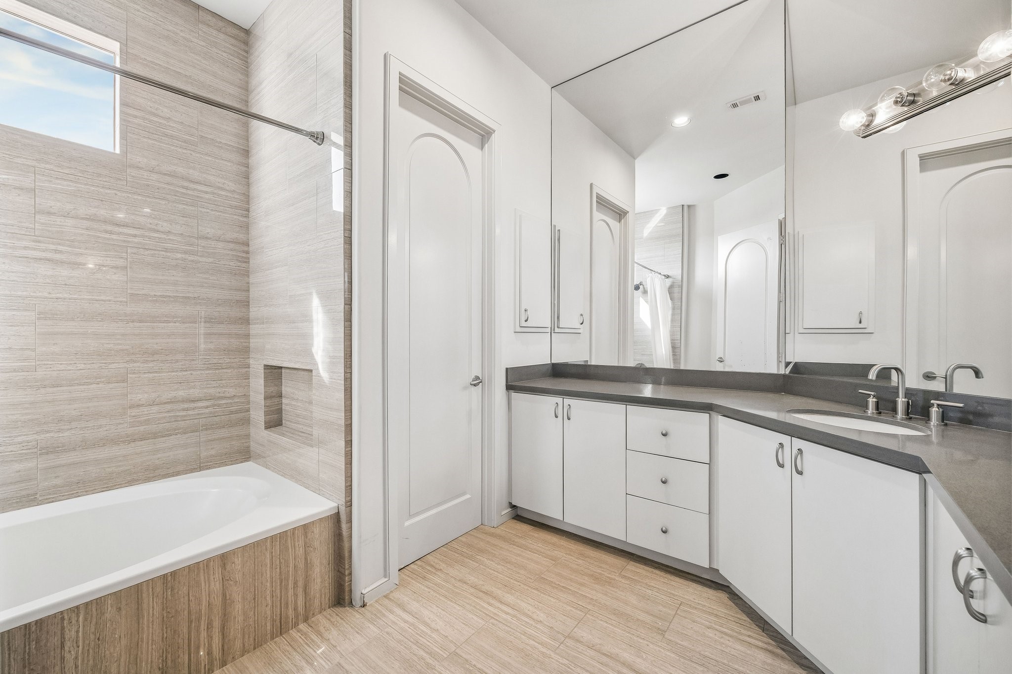 ENSUITE BATH FOR BEDROOM 4 - soaking tub with shower - abundant counter space and built-in cabinetry for towels, toiletries and more