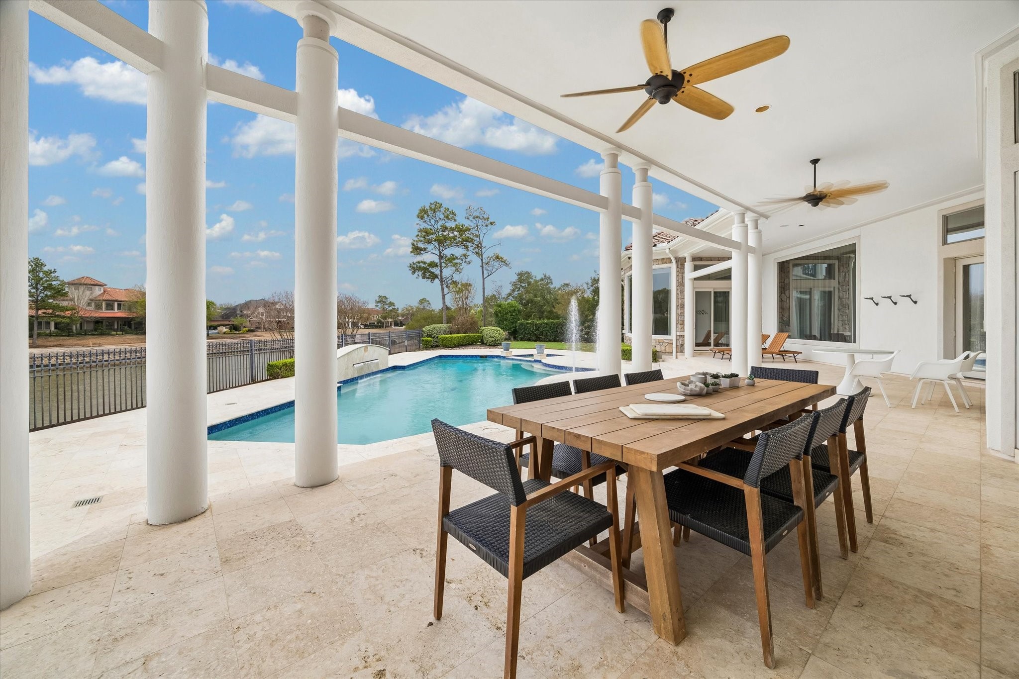 COVERED TERRACES IDEAL FOR ALFRESCO DINING AND ENTERTAINING - with beautiful views throughout the day and evening overlooking the pool/spa, lake and golf course