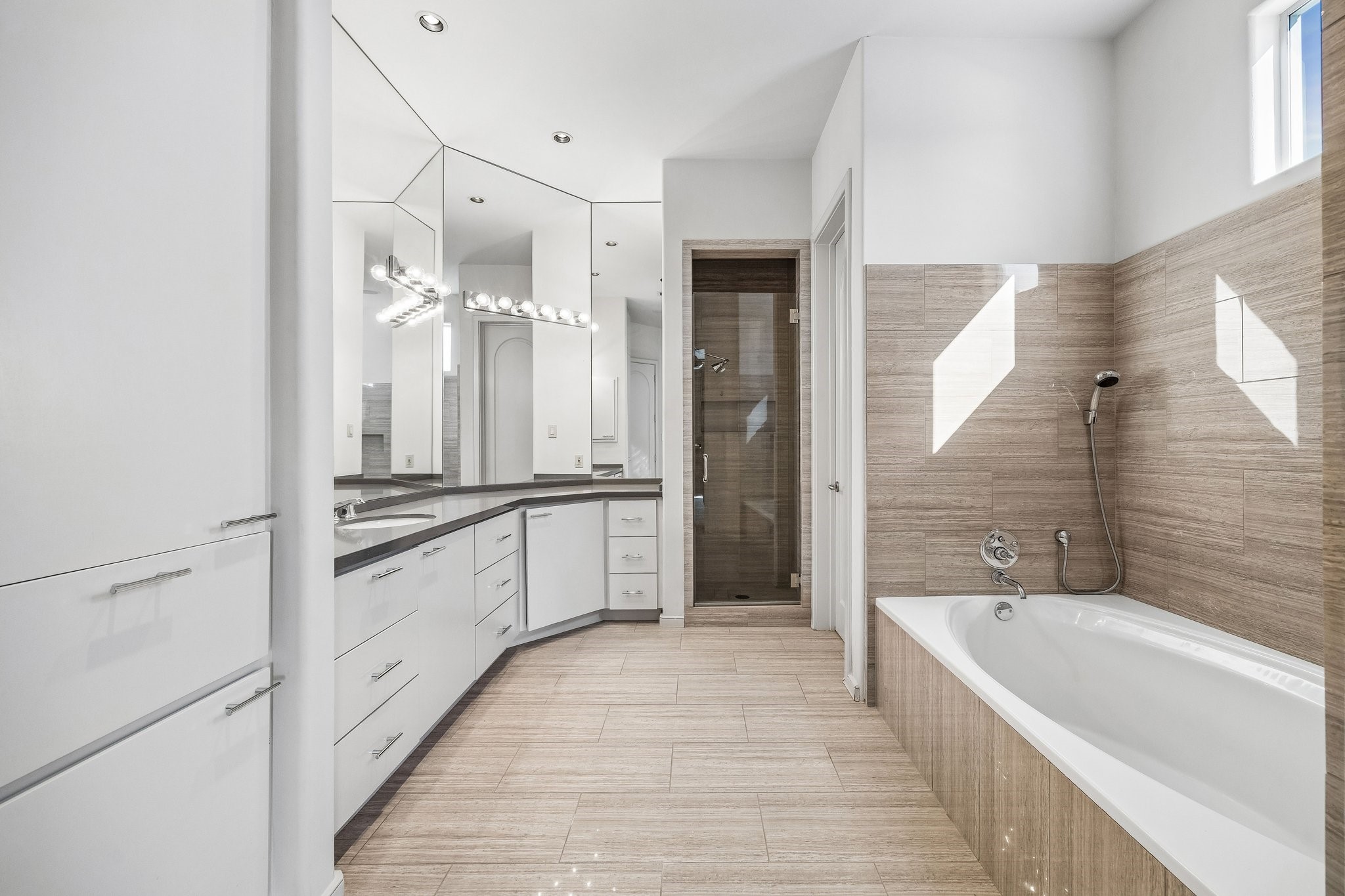 ENSUITE BATH FOR BEDROOM 3 UPSTAIRS - a restorative retreat with soaking tub and separate shower - abundant built-in cabinetry for towels, toiletries and more - with spacious walk-in closet