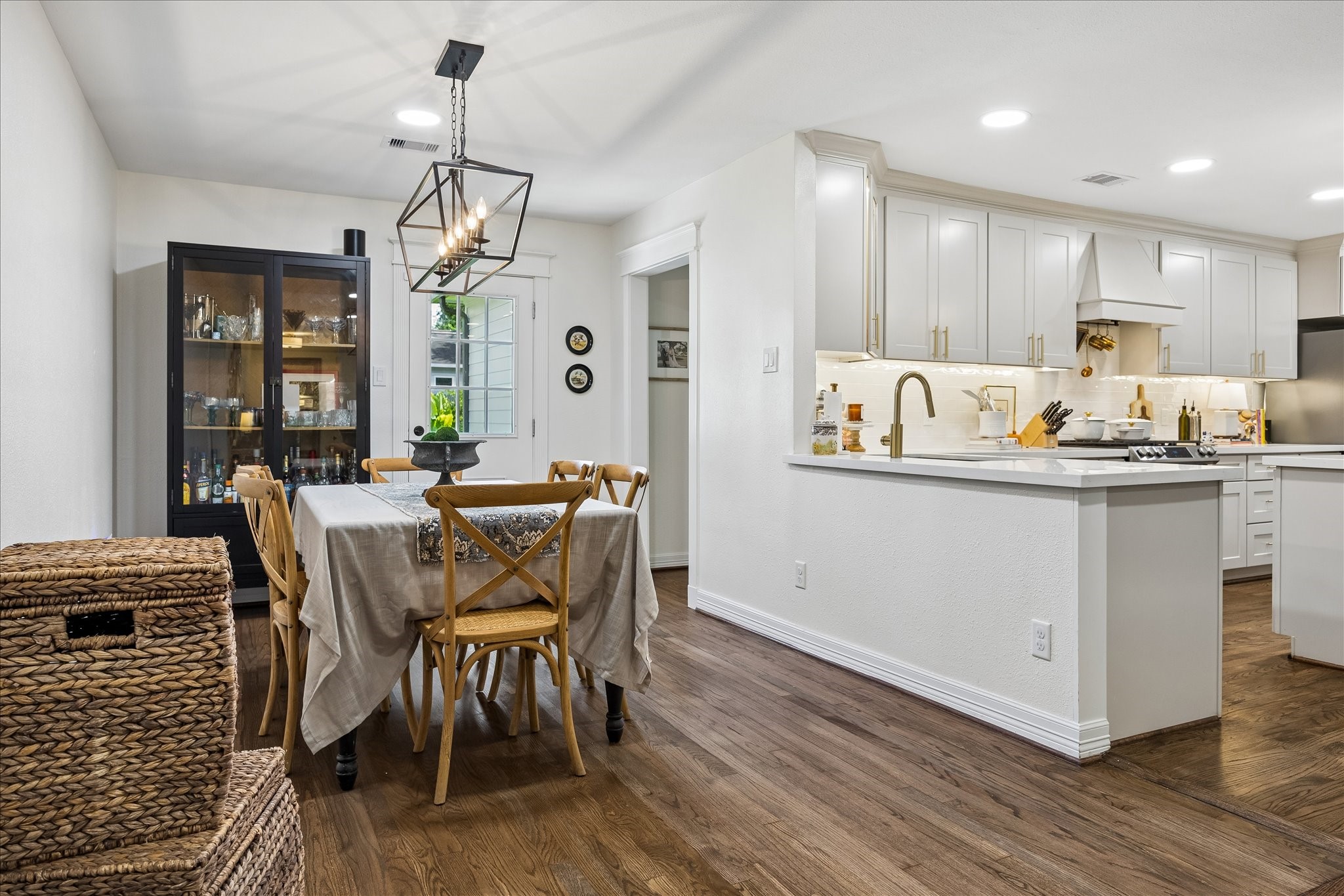 View of kitchen and dining from entryway