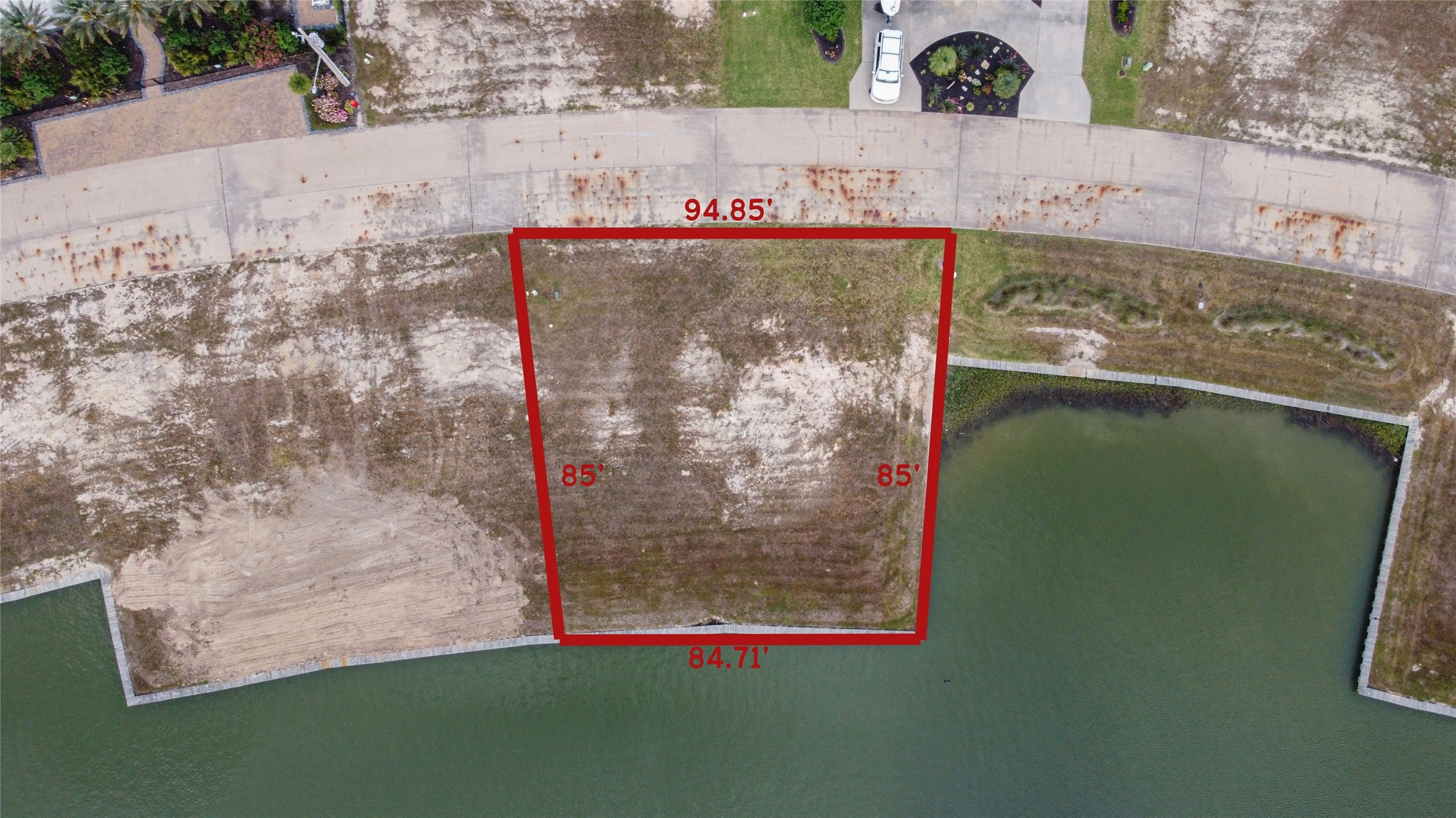 Property lines are approximately. 
Enjoy the views and fishing opportunities with over 84 feet of waterfrontage in the back. This homesite allows for a pier across the bulkhead and boathouse to be built next to the property in the landscape reserve area. Please ask for survey for exact dimensions and locations of the pier and boathouse designations.