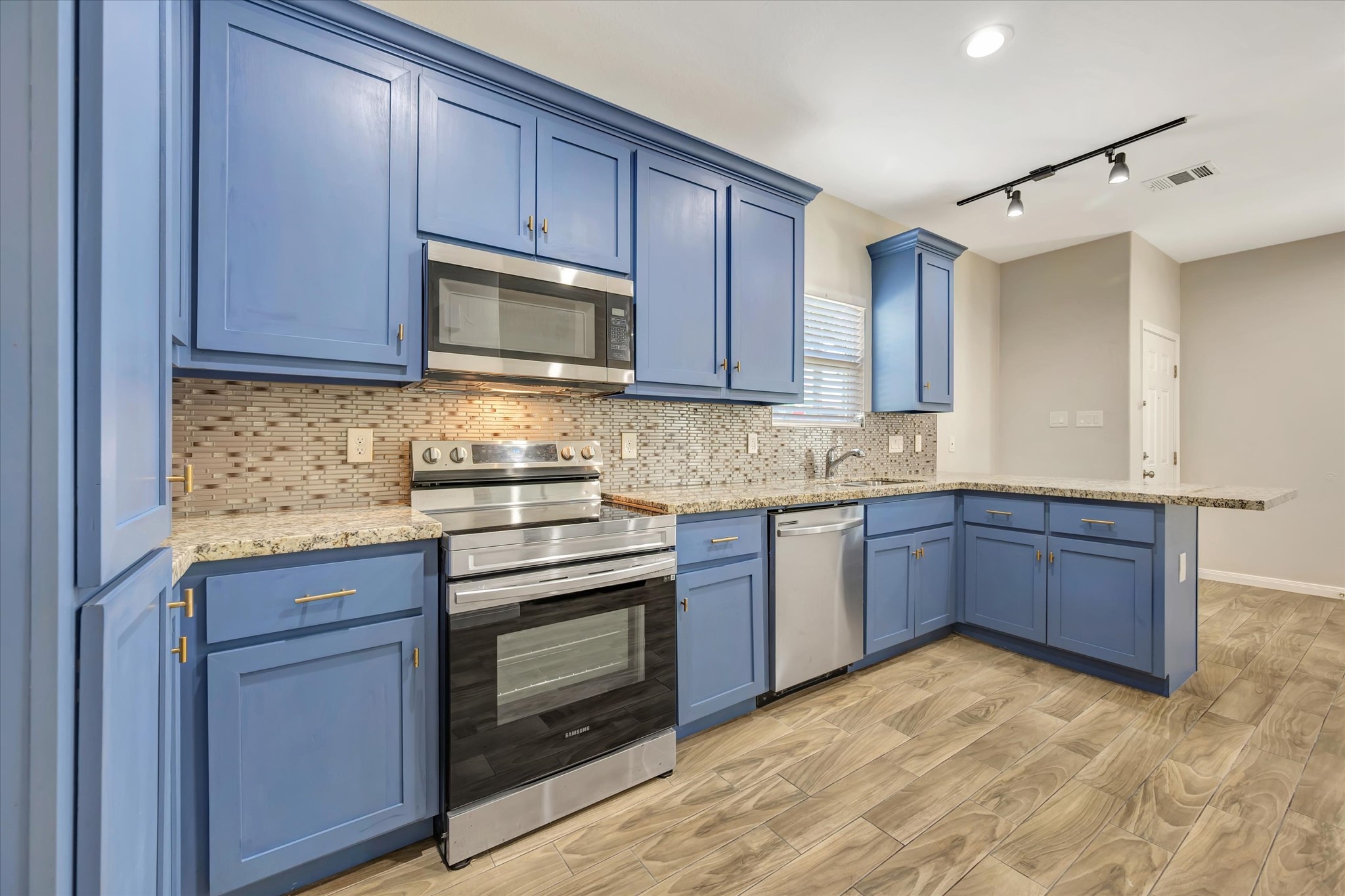 Kitchen appliances are stainless steel ap