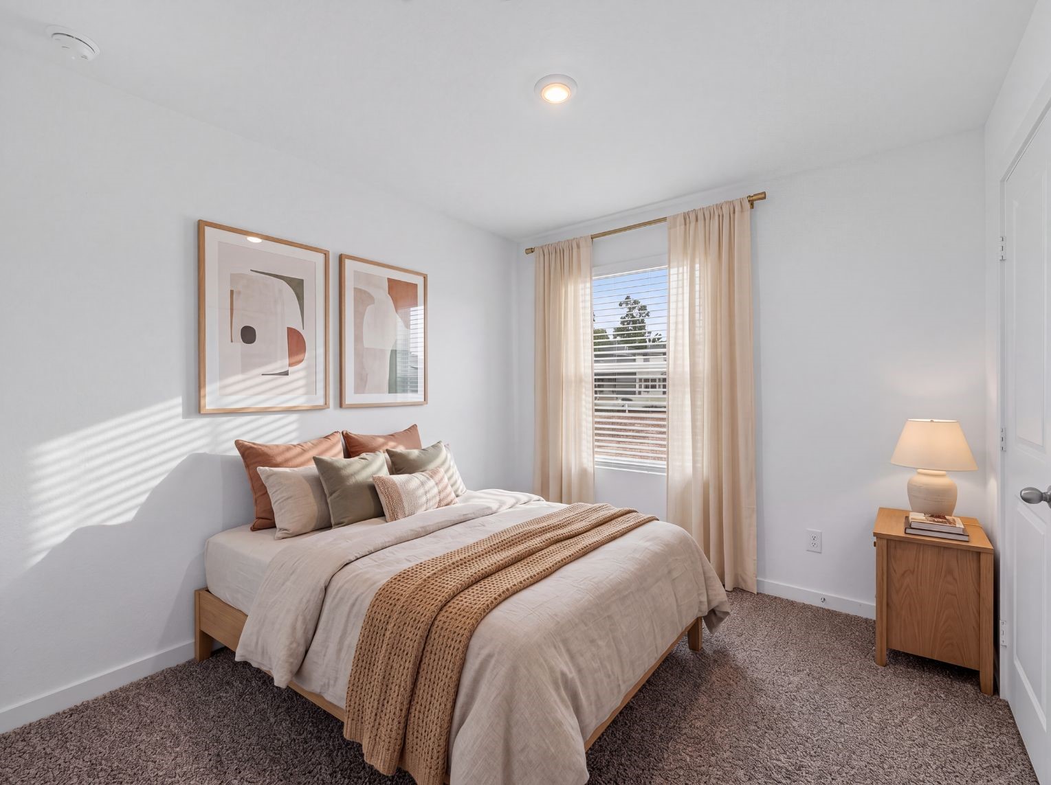 Secondary bedroom with carpet, a large window for natural light, and a closet. A comfortable, flexible space.
This photo has been digitally staged to illustrate the possibilities of the home's aesthetic and potential design. Some furnishings and dcor shown are for visual inspiration.