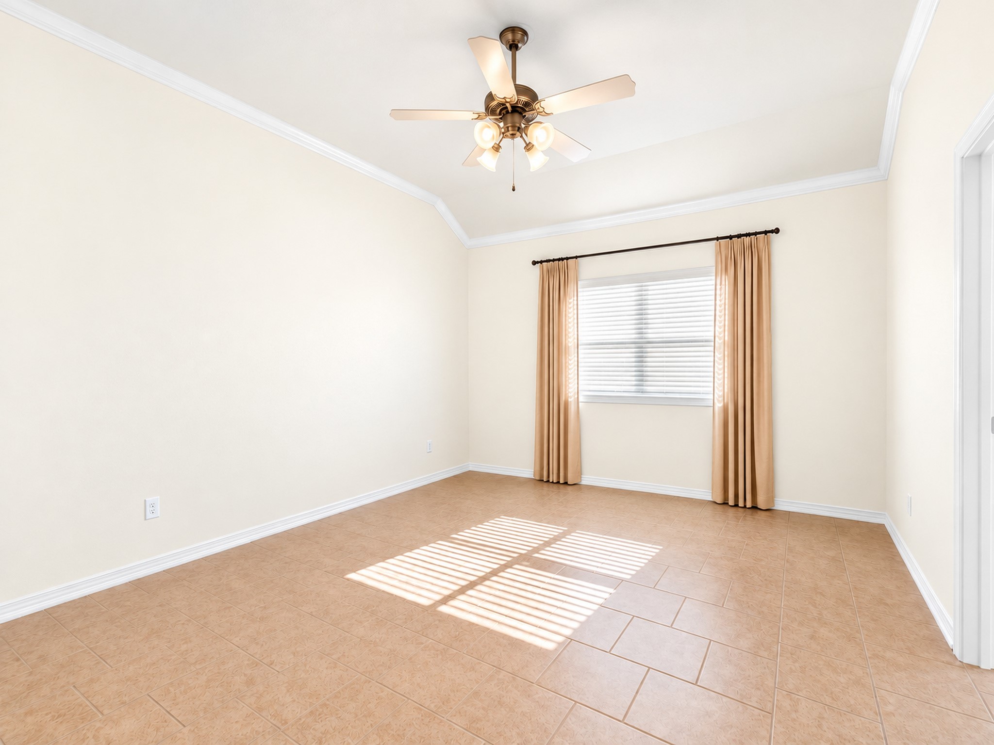 Another bedroom angle highlights the tray ceiling, neutral finishes, and natural light.