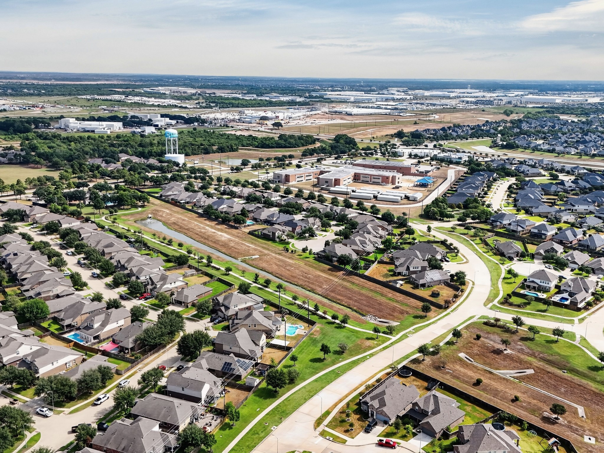 Elevated view highlights the neighborhoods residential streets and surrounding area.