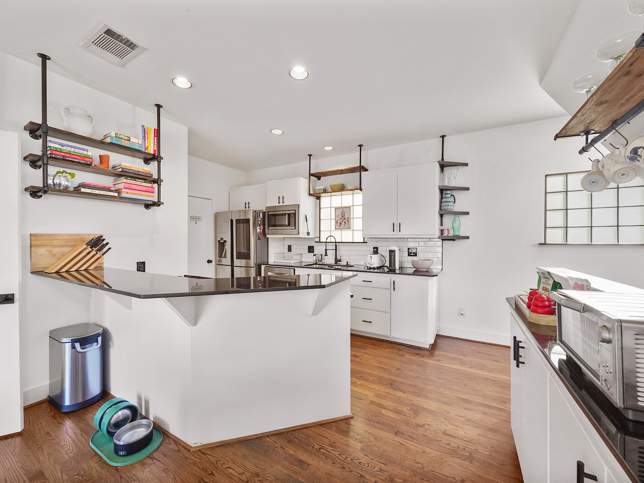 Enjoy the perfect blend of style and functionality in this open-concept kitchen, complete with a sleek breakfast bar ideal for casual dining and entertaining.