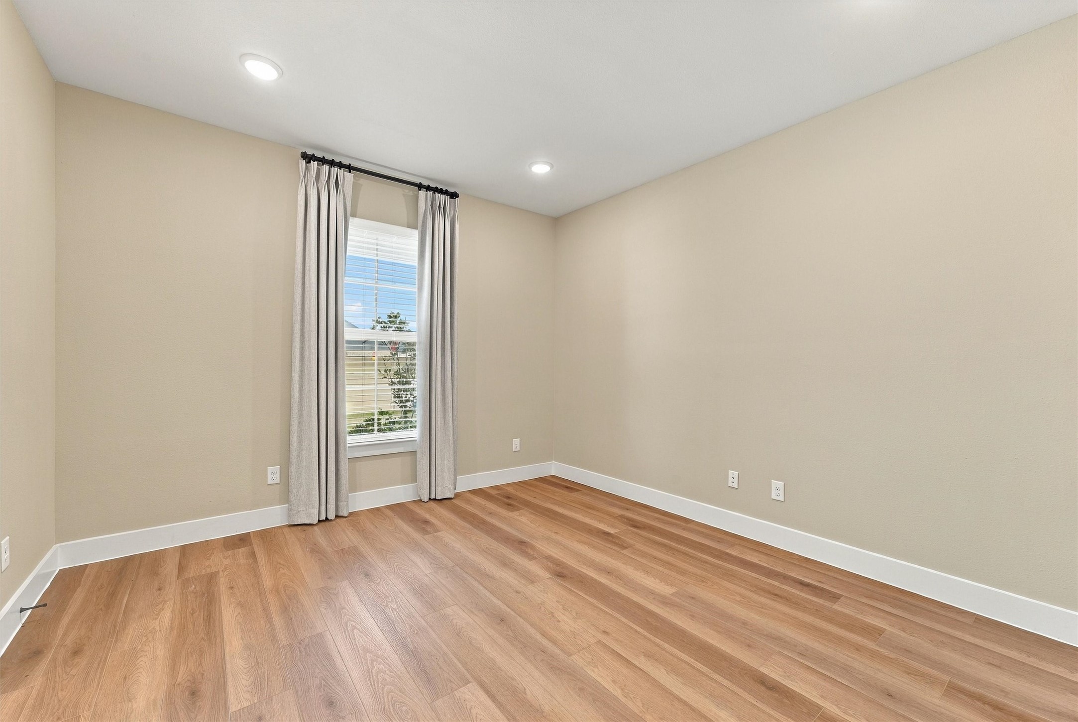 Quiet study with tailored drapery and soft natural light, ready to work as an executive home office. Quiet study with tailored drapery and soft natural light, ready to work as an executive home office.