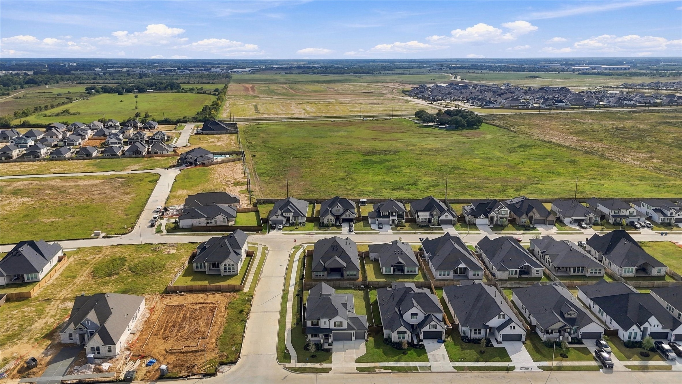 A sweeping view of the homesite in Attwater, with open Texas countryside around it.