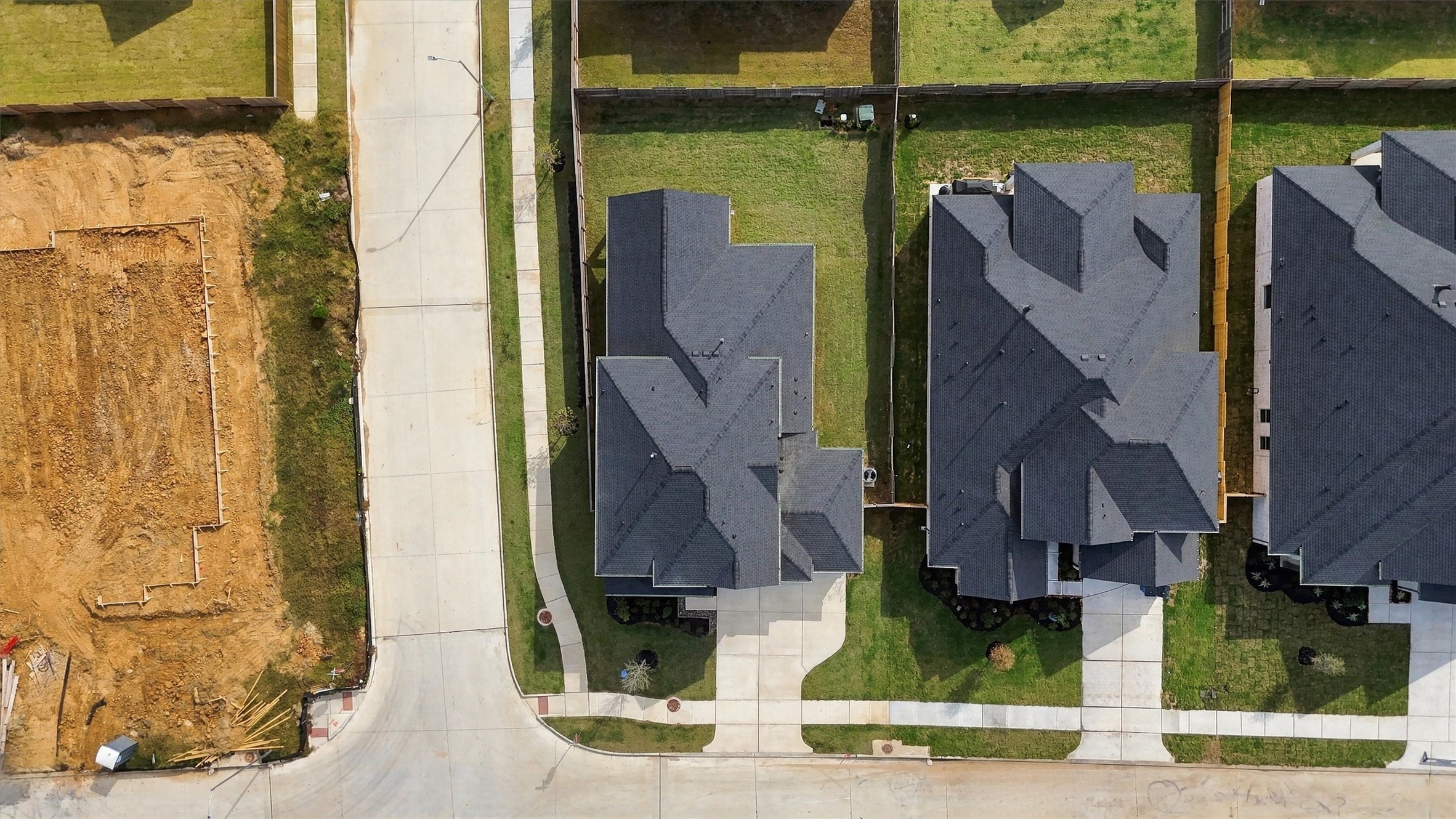 A top-down view of the corner lot and the full footprint of the fenced backyard.