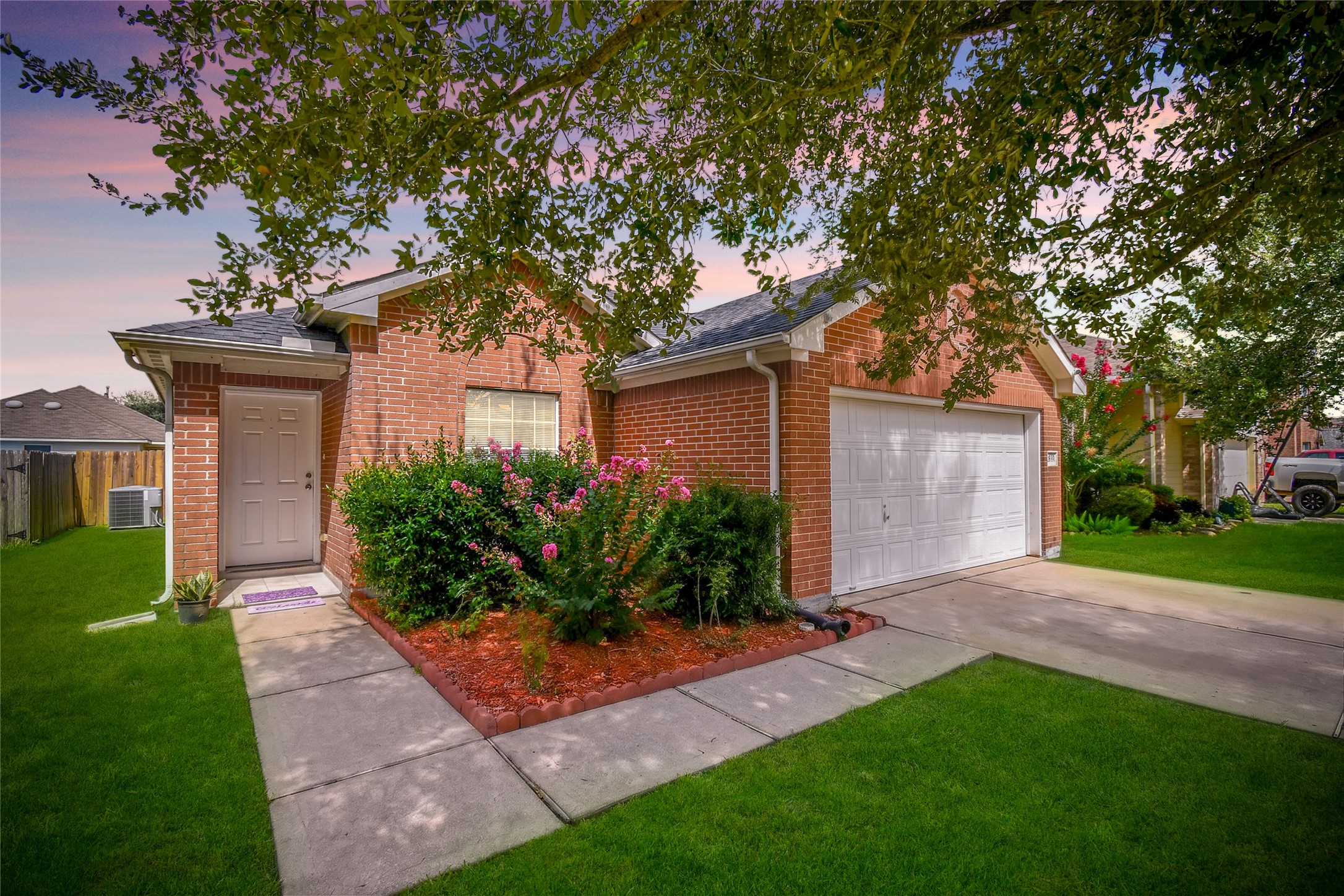 Stunning twilight view showcasing the home's curb appeal and warm, welcoming exterior. Stunning twilight view showcasing the home's curb appeal and warm, welcoming exterior.