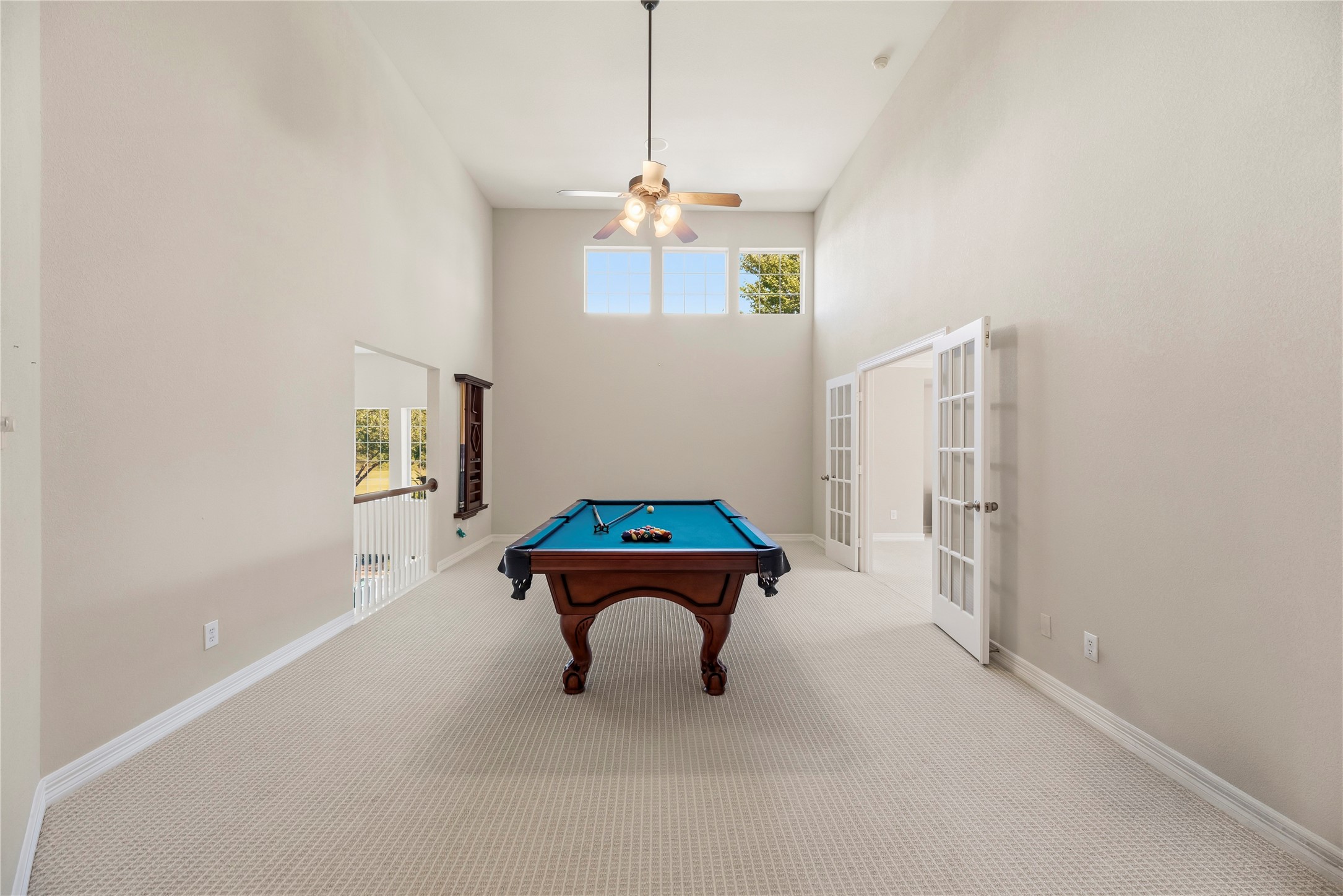 Large game room has plenty of space for pool table, ping pong, or just hanging out watching the game.
