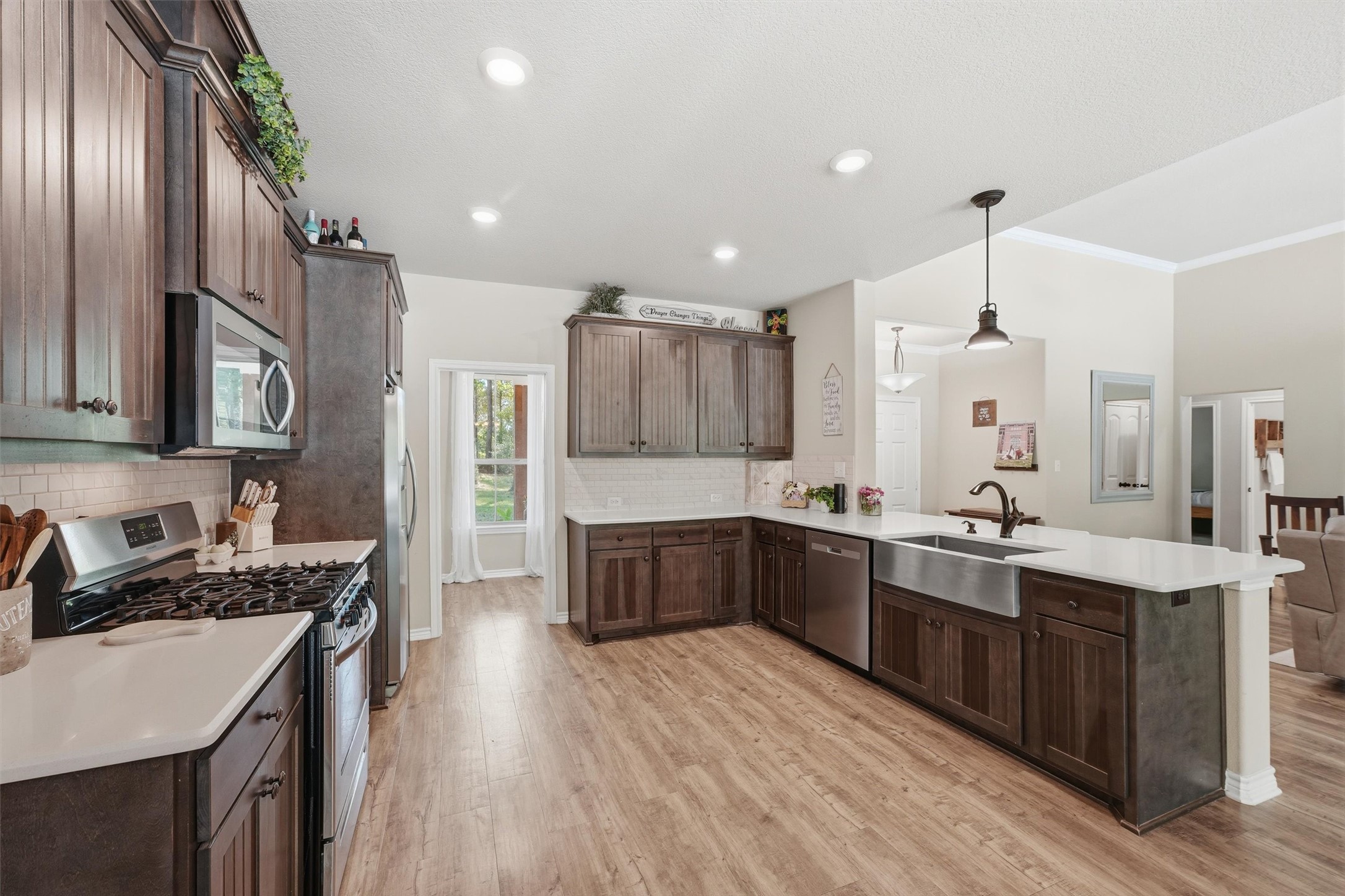 Such a well kept home.  It feels brand new.  The stainless farmhouse sink, gas range, microwave and dishwasher are all so stylish.
