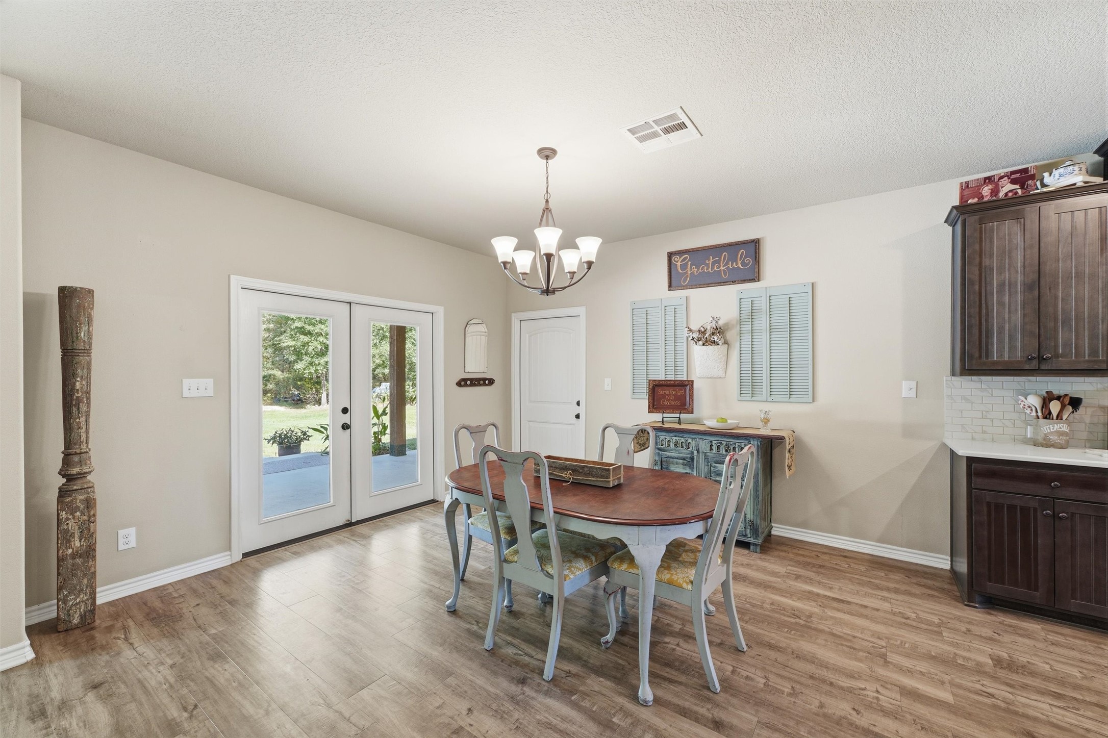 Any size dining set can go in this location. Enjoy a meal while getting great views of the outdoors.