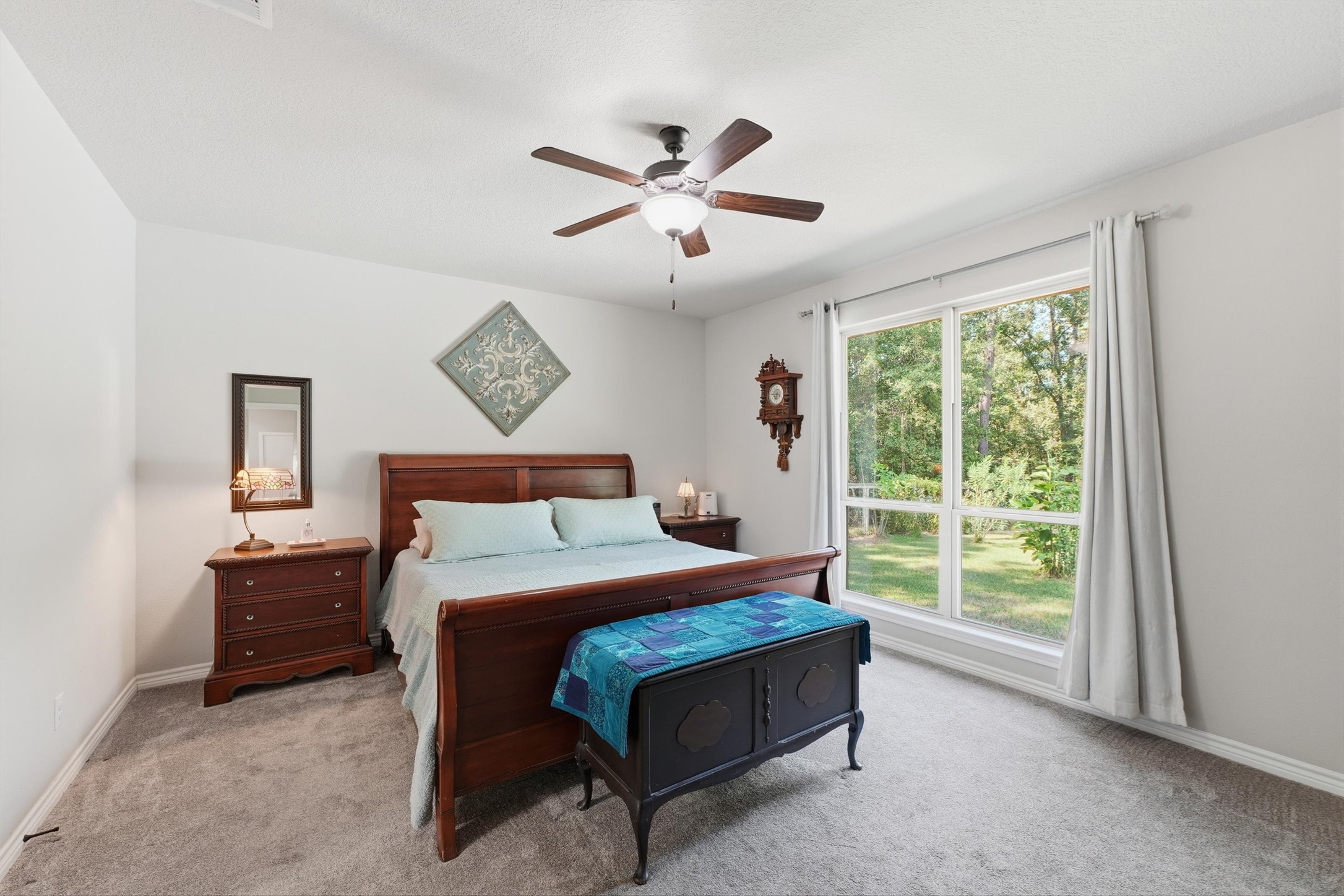 Large primary bedroom is very spacious and great views of the backyard.