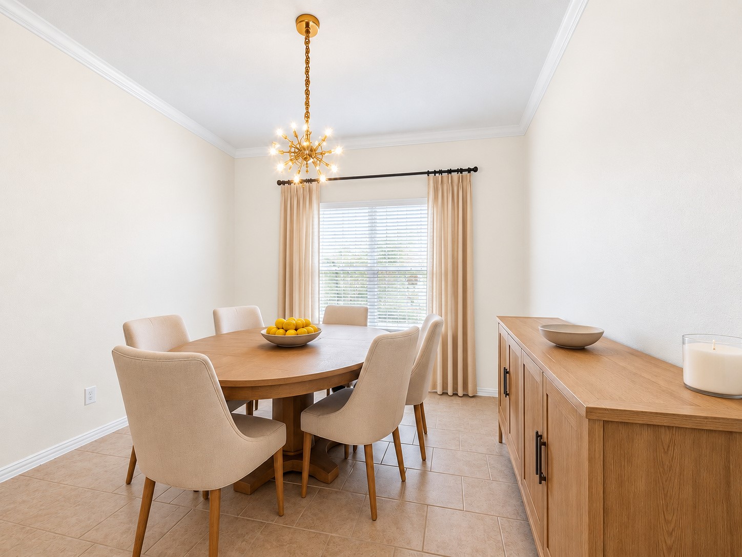 Furnished dining room view illustrates space for a dining table and coordinating storage furniture. (Virtually staged)