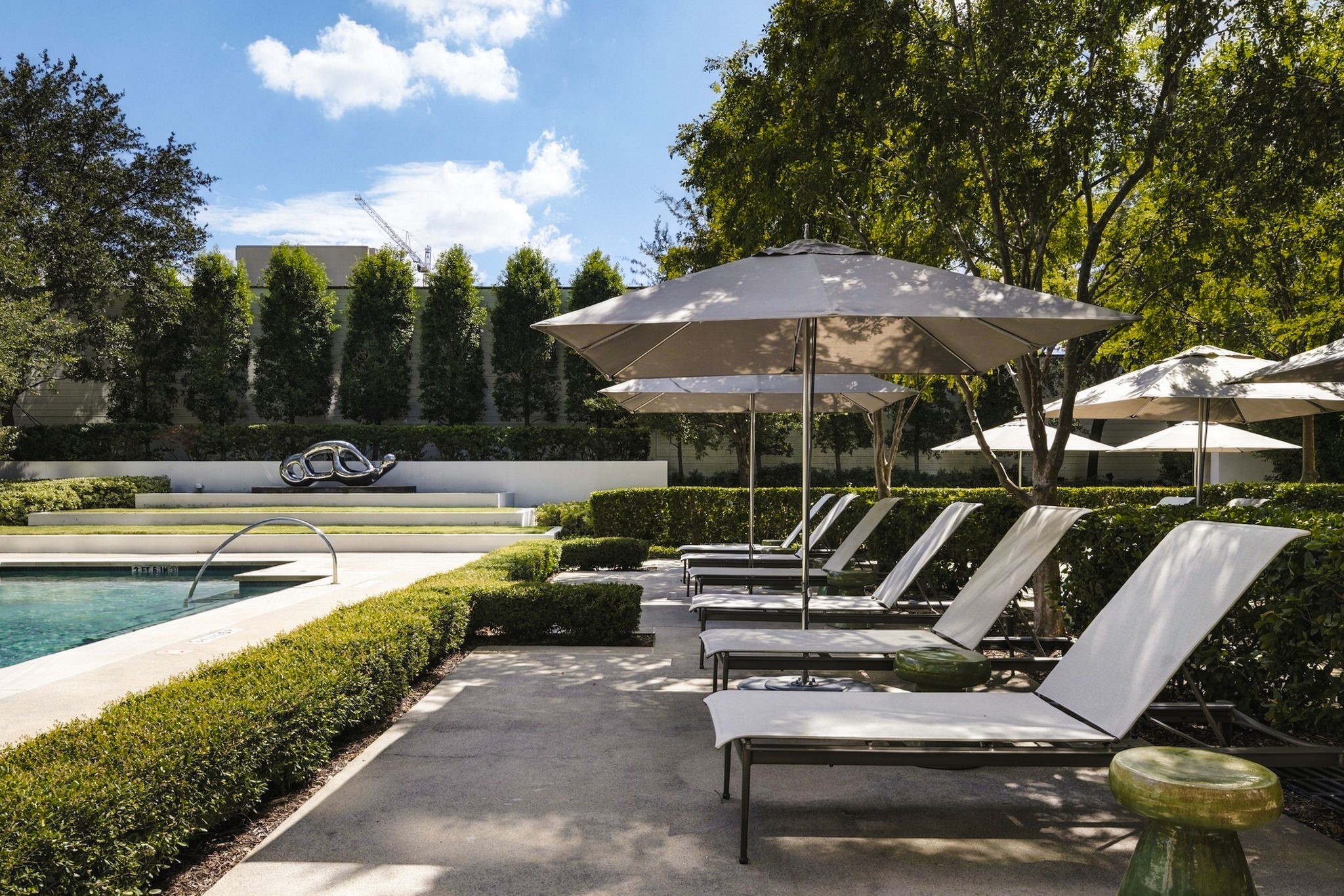Shaded lounge area flanking the pool.