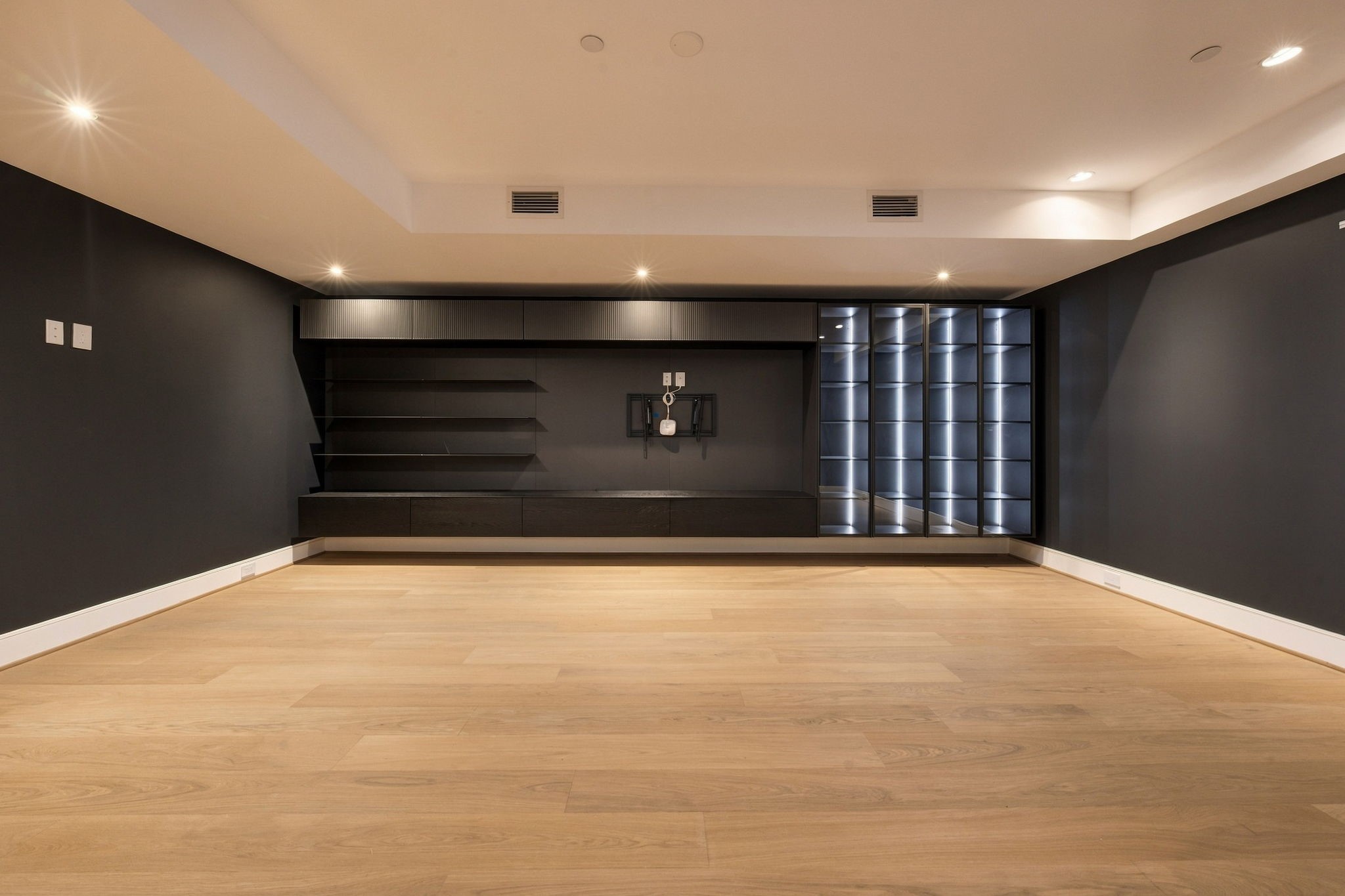 Large, moody media room upstairs.
