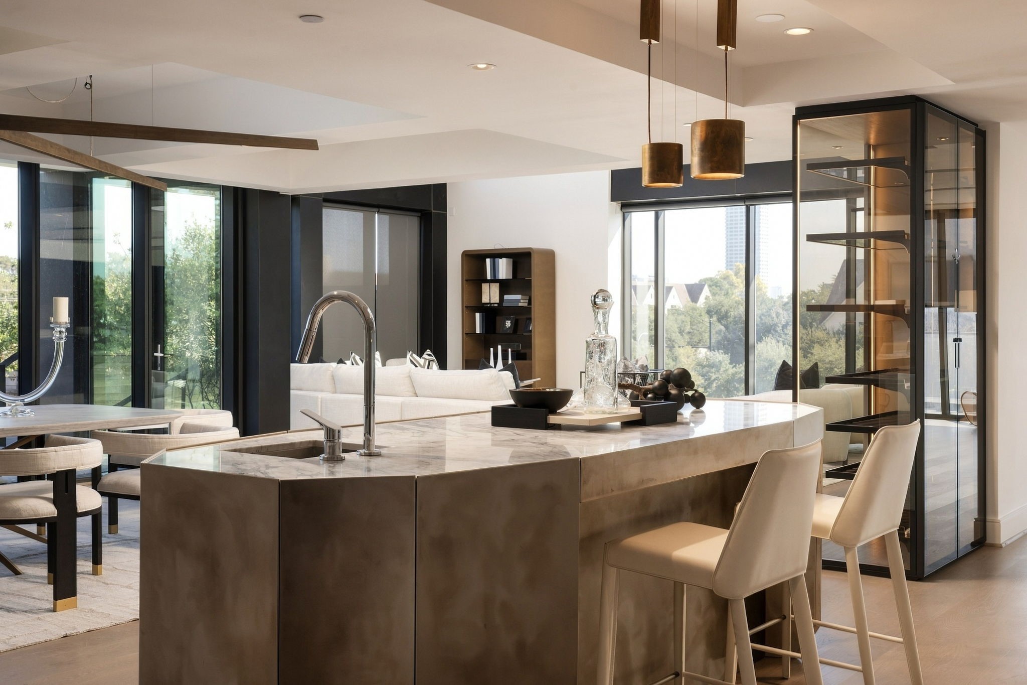 Work-of-art Henge marble and burnished steel bar with a beverage center and ice maker adds drama and sophistication.