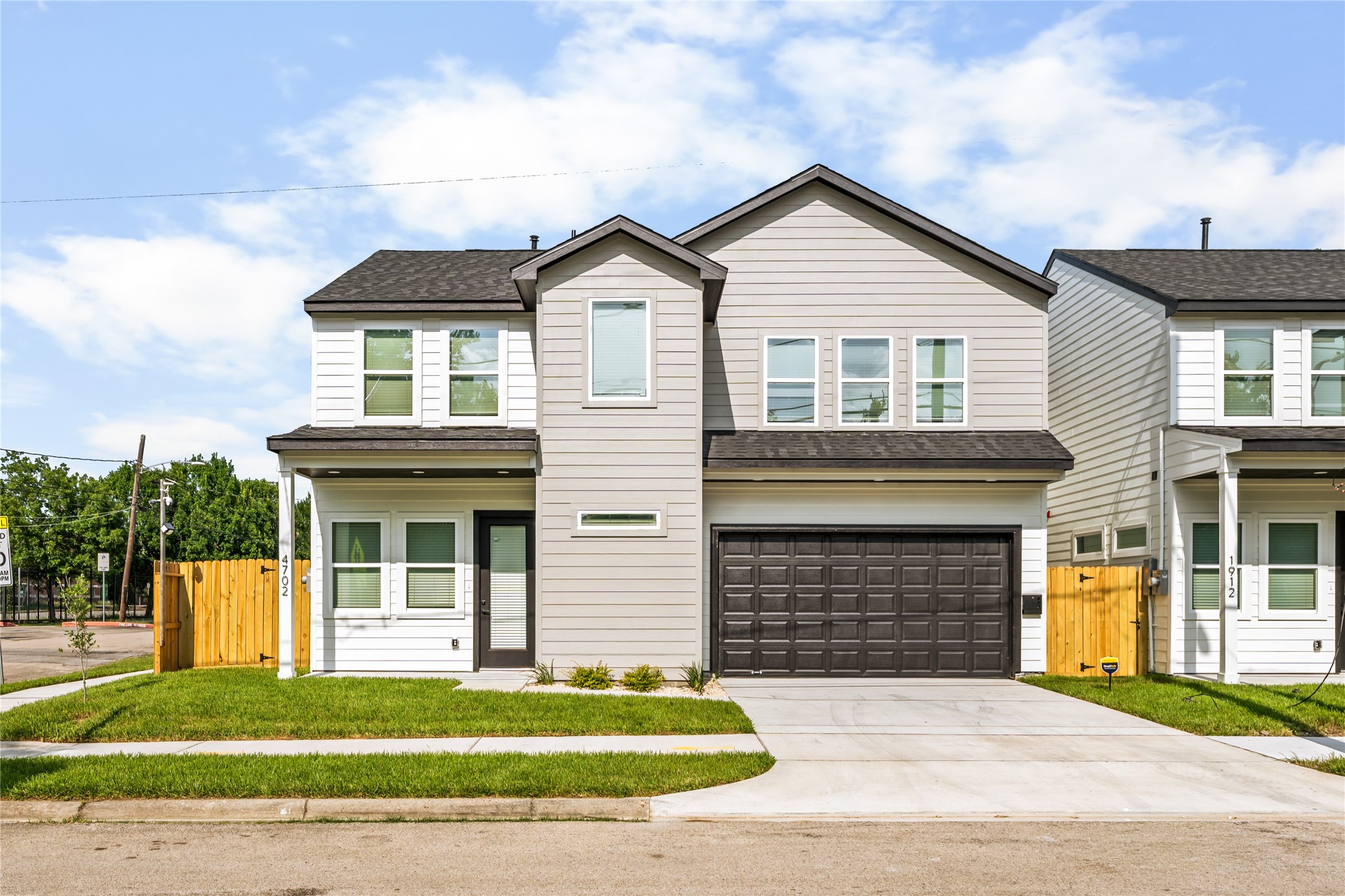 Clean lines and commanding presence. Exceptional architectural details, oversized energy-efficient windows, and a paved concrete driveway offer a premium first impression.