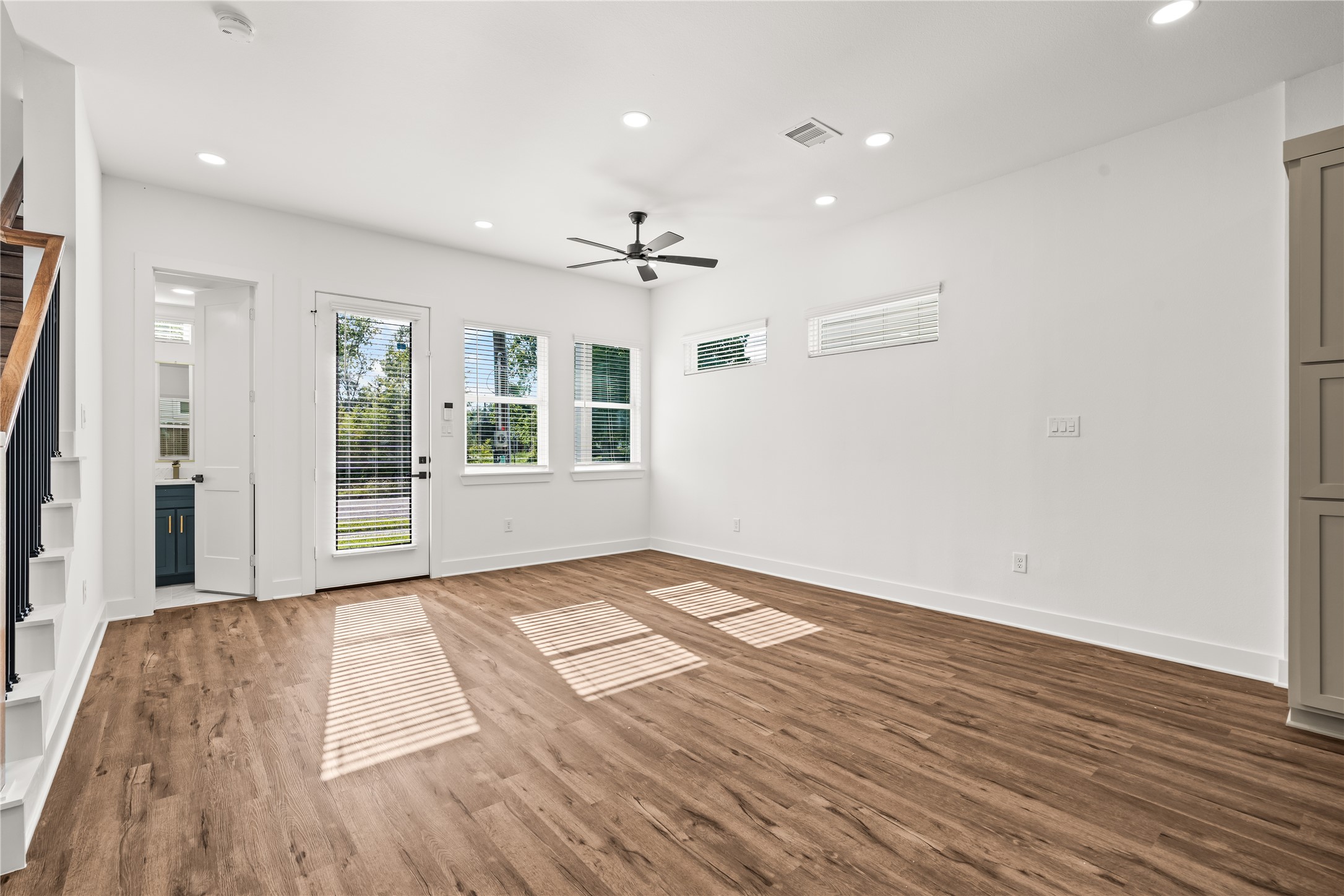 Sun-drenched afternoons await. Striking linear shadows filter through the windows, emphasizing the impressive footprint of the main level.