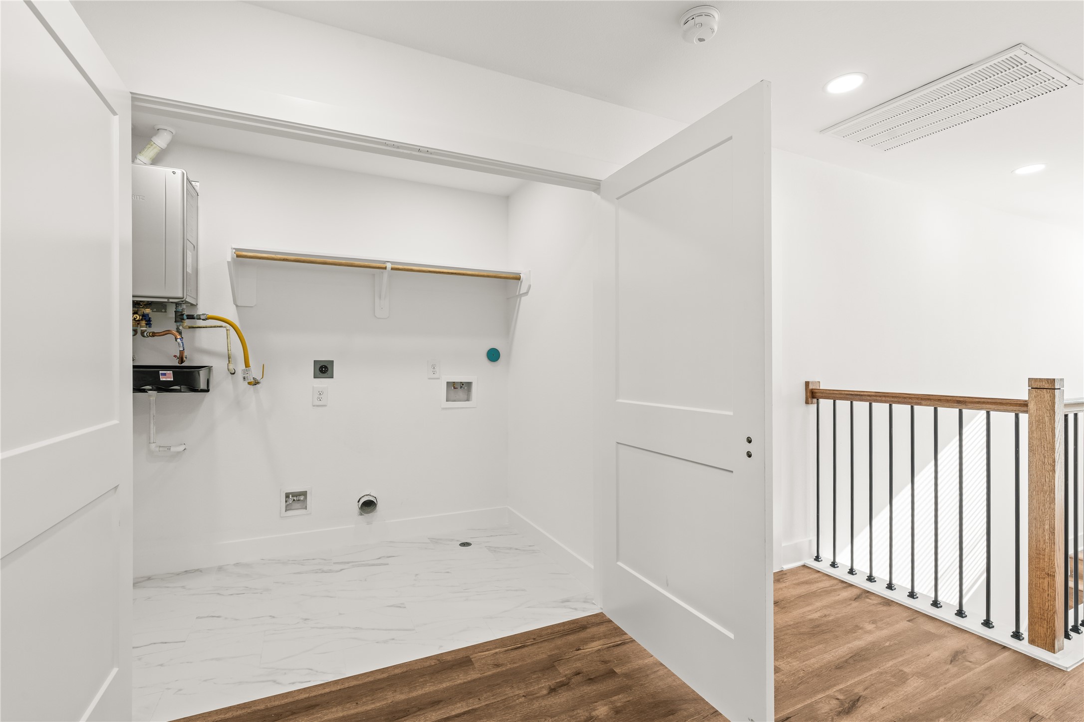 Efficiency at its finest. No more carrying heavy baskets up and down the stairsthis upper-level laundry zone puts chore day right where the bedrooms are.