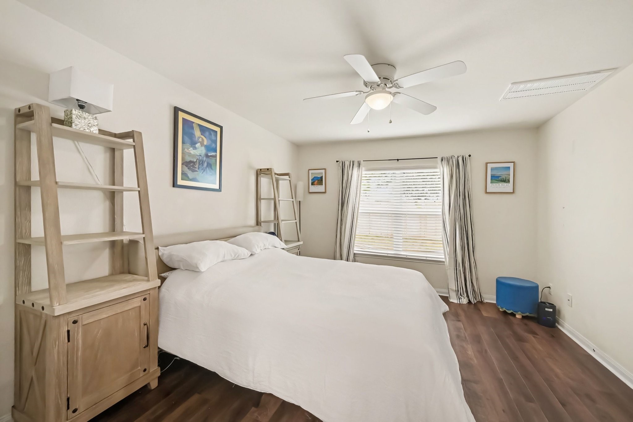 Primary suite view highlighting the large window and bright, airy feel of the space