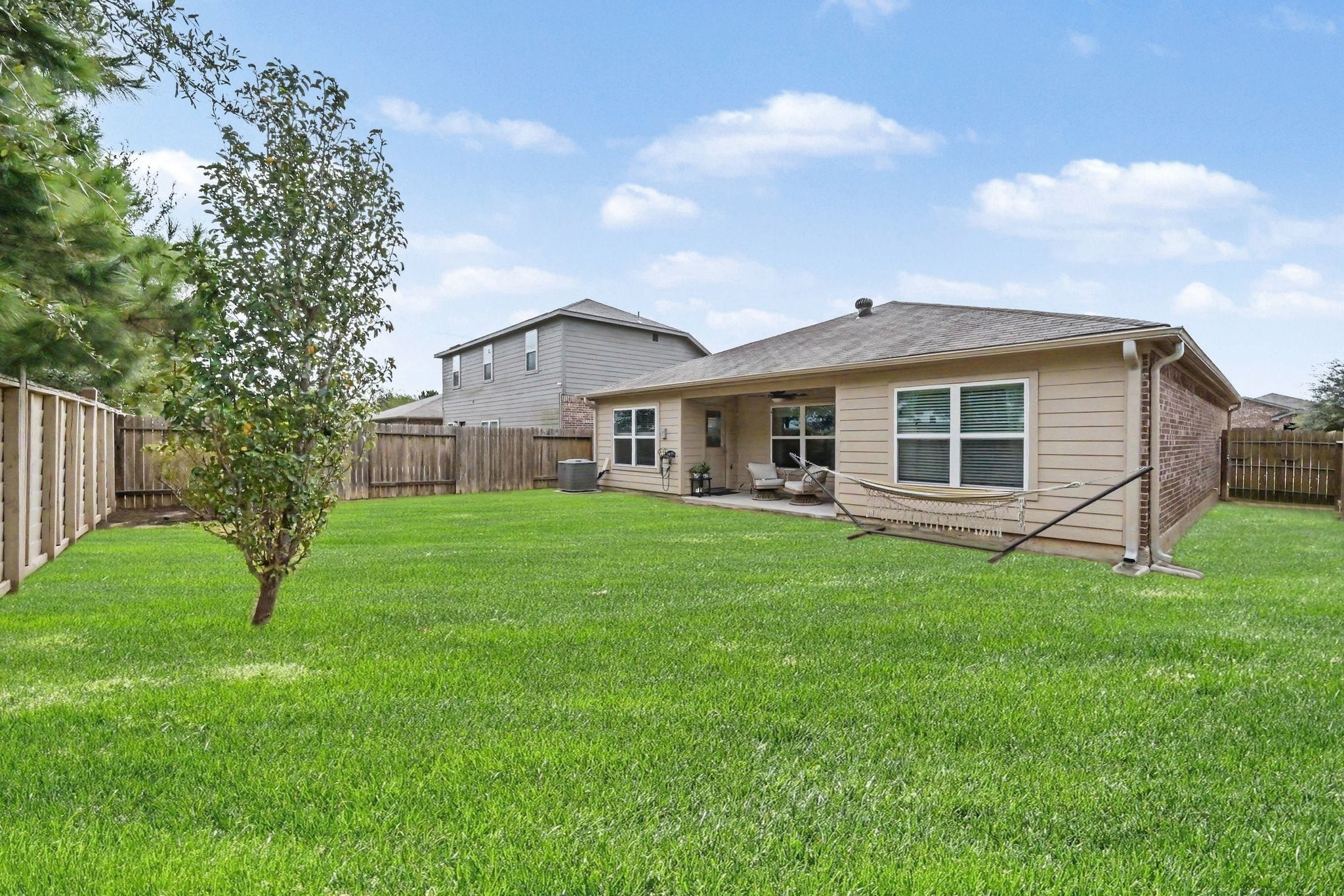 Generous backyard space with plenty of room for play, gardening, or outdoor activities