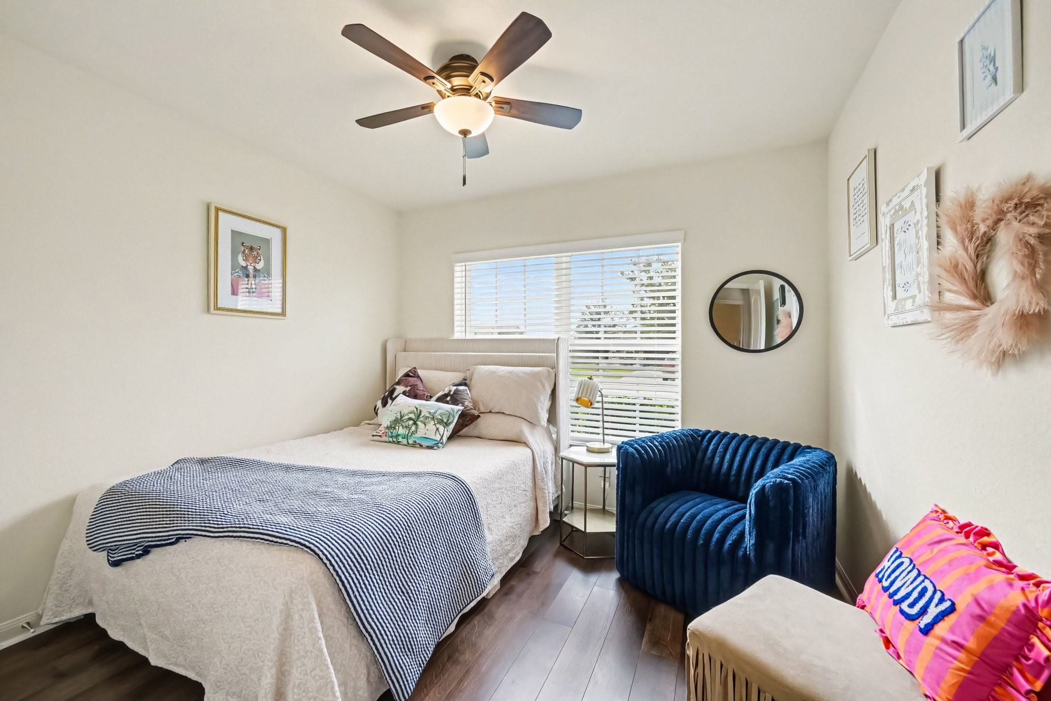 Bright secondary bedroom located at the front of the home with plank laminate flooring