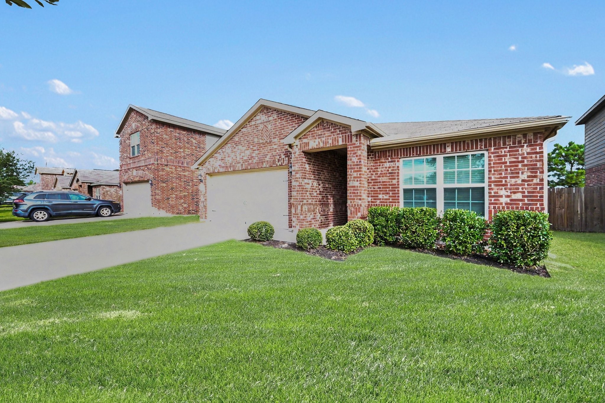 Alternate front view showcasing the home's charming curb appeal and spacious lot