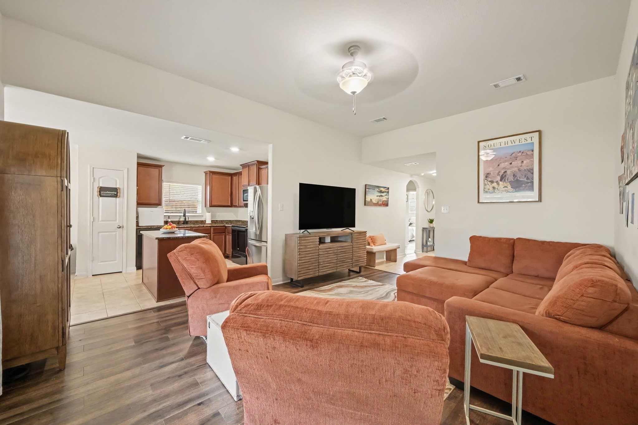 Family room view highlighting the open-concept flow into the kitchen and dining area