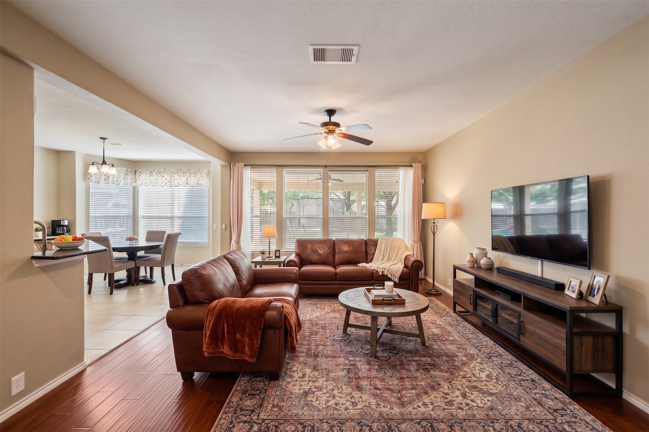 The living room is open to the kitchen and breakfast area.  Virtually staged photo.