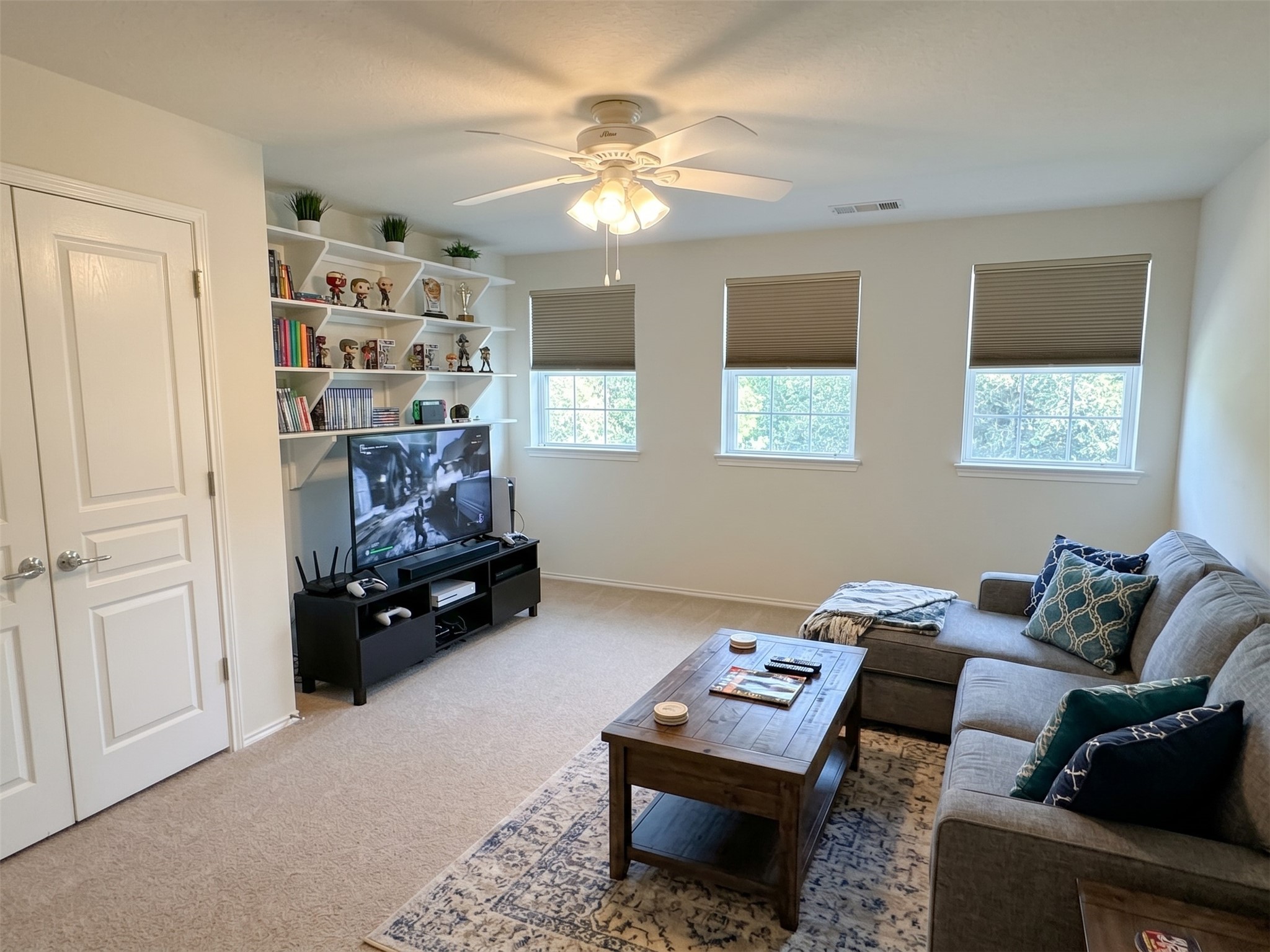 The game room is located at the top of the stairs, features a full closet if you need a 6th bedroom.  Virtually staged photo.
