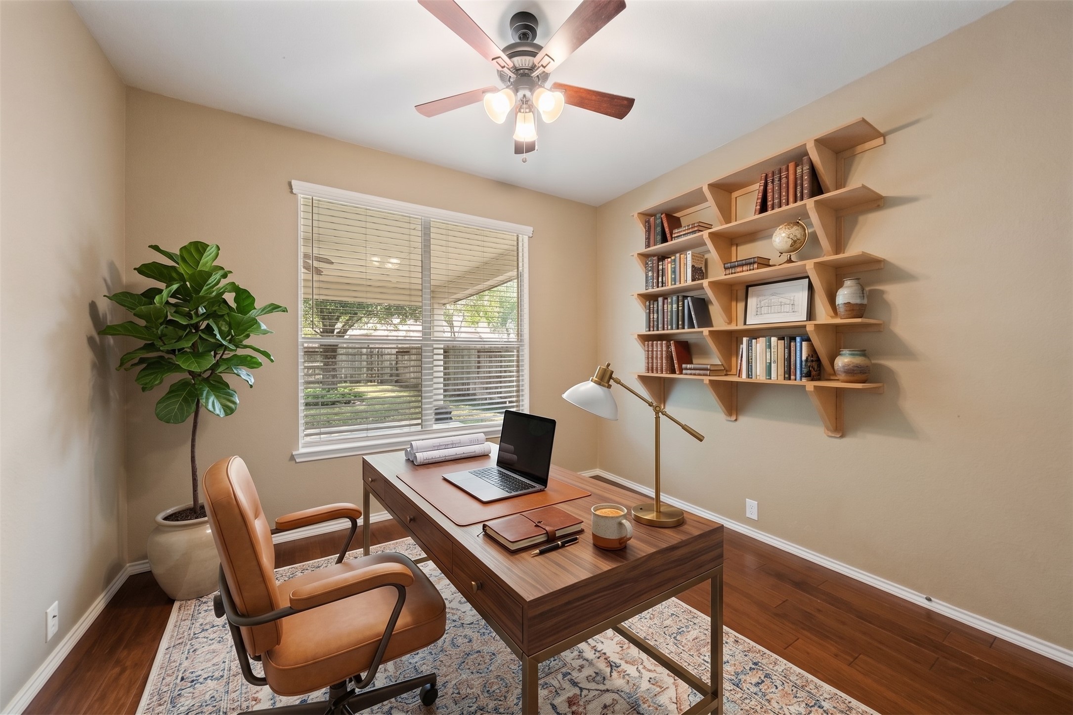 This 5th bedroom or home office is downstairs with easy access to the full bath down.  Virtually staged photo.