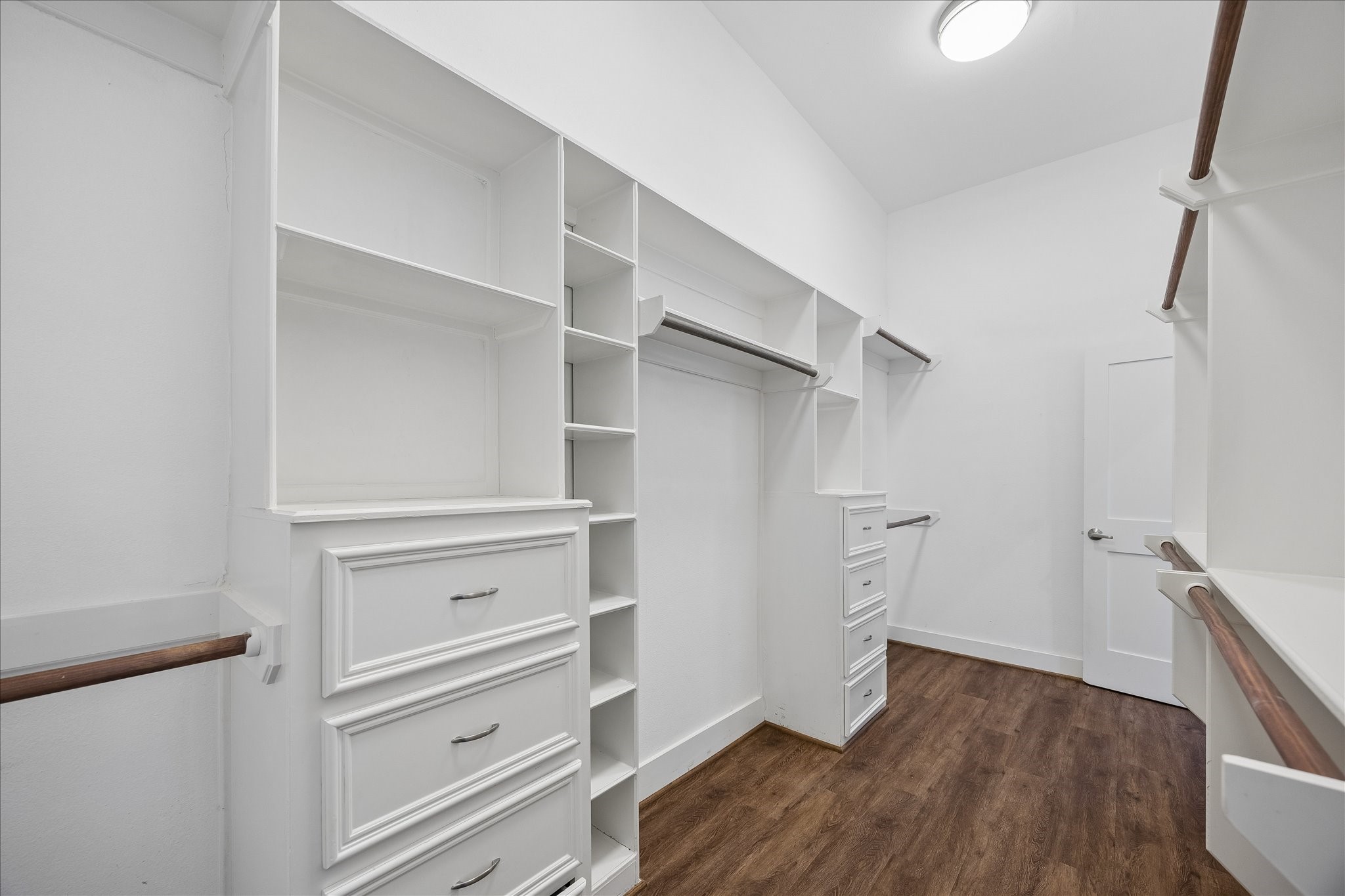 Now this is a closet you can get excited about! Custom built-ins, ample shelving, hanging space and drawers offer a place for everything, making it easy to stay organized and keep clutter out of sight.