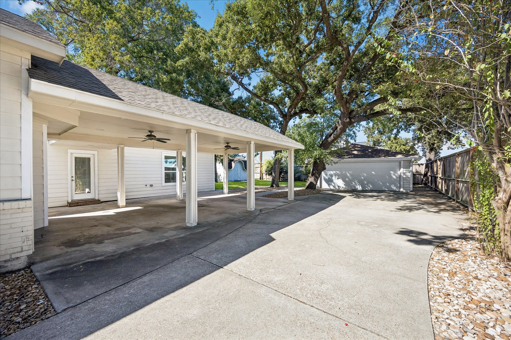 There's room for everyone to come and go with ease. The expansive gated driveway offers plenty of parking, with a covered area and detached garage for added convenience. Recent upgrades include fiber internet to the garage, a 240V electrical subpanel and an upgraded driveway gate opener with oversized arm and commercial grade magnetic lock.