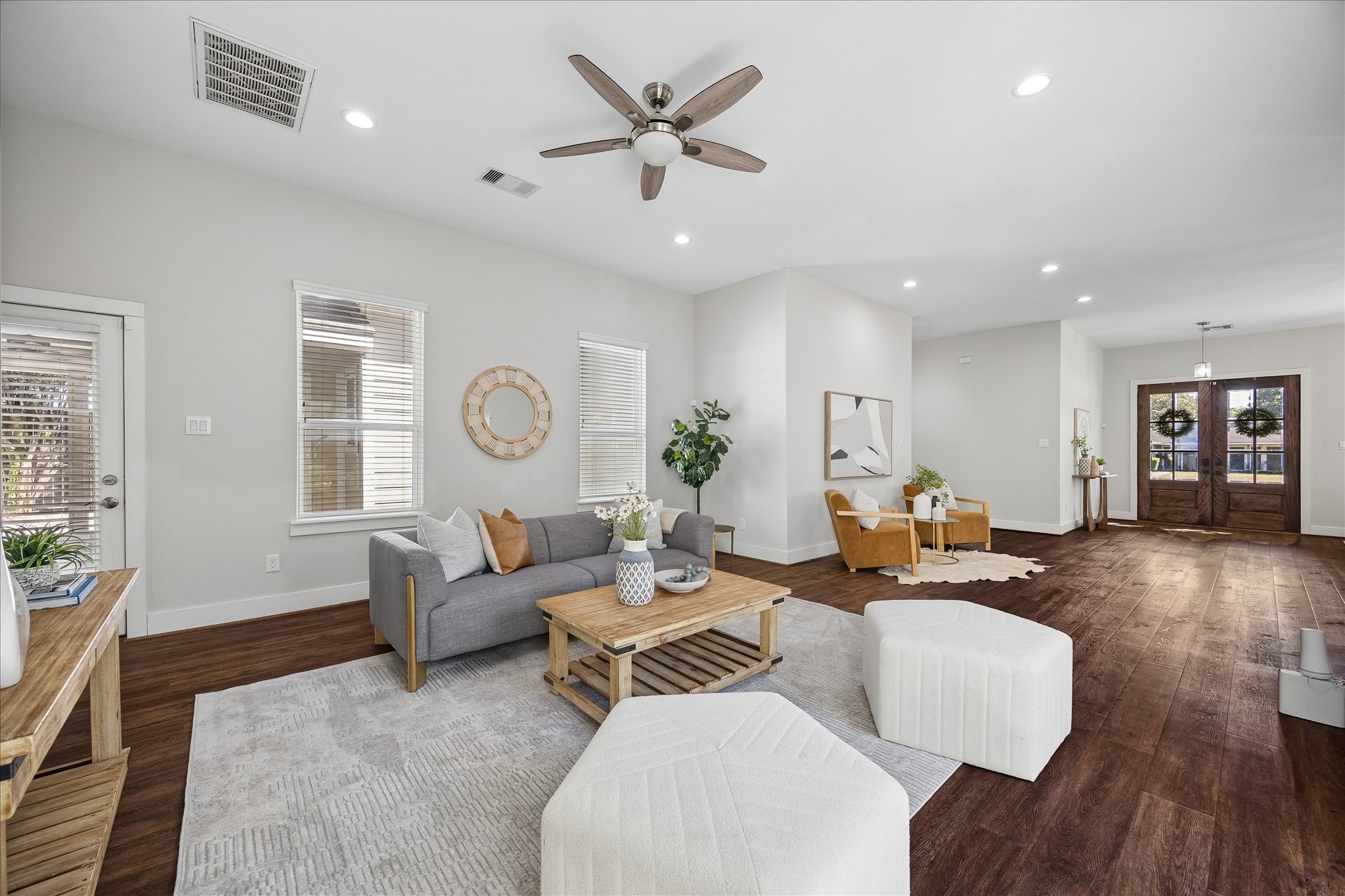 Come on in and make yourself at home! This bright, spacious living area offers plenty of room to relax, entertain and enjoy the comforts of home. Updated luxury vinyl tile flooring, recessed lighting and amazing natural light add to the appeal, while the open layout keeps everyone connected.