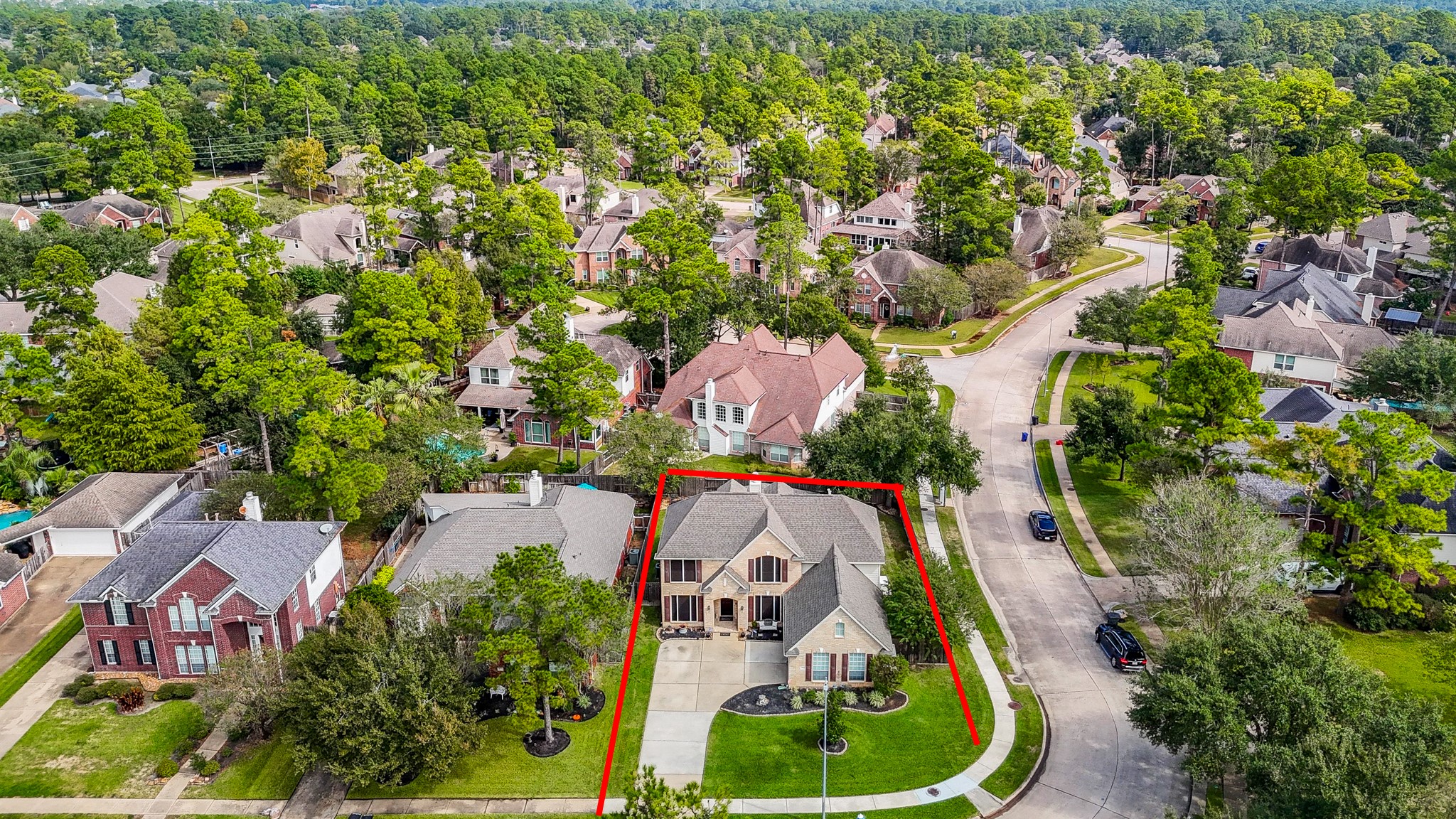 Beautifully situated along a gently curving street, this home enjoys a prominent corner location with an attractive lawn, mature landscaping, and a welcoming residential setting.