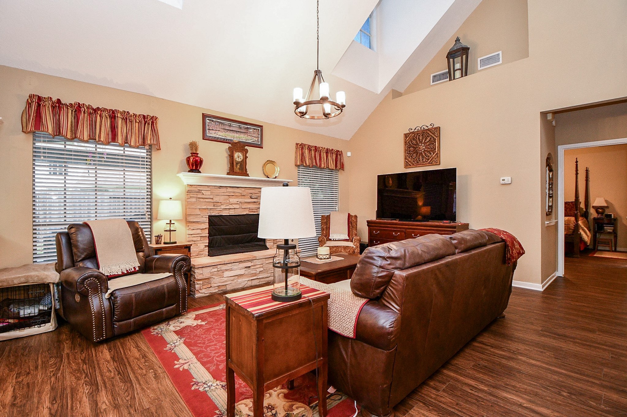 Imagine coming home, kicking off your shoes and settling in for a relaxing evening. Soaring ceilings, natural light and a beautiful stone fireplace create an inviting gathering place, while easy-care flooring makes everyday living that much simpler.