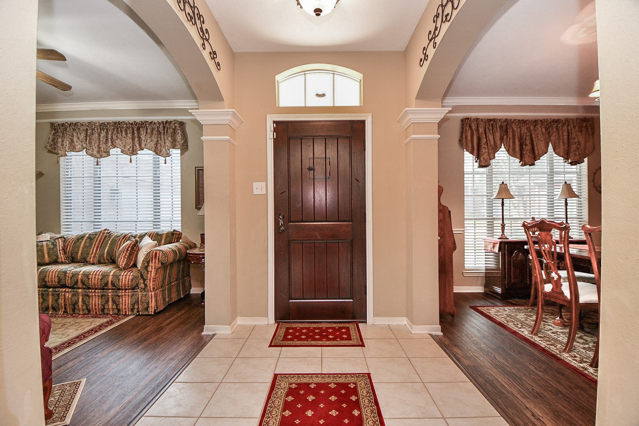 Step inside to discover soaring ceilings, graceful archways and a traditional floor plan offering generous living spaces. With luxury vinyl flooring and tile throughout, there's no carpet to worry about!