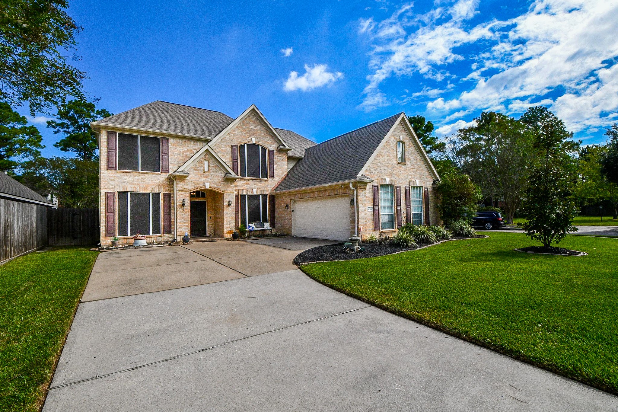 Plenty of room for the comings and goings of everyday life! An extended driveway provides generous parking space, while the home's traditional architecture and established surroundings create a sense of home from the moment you arrive.