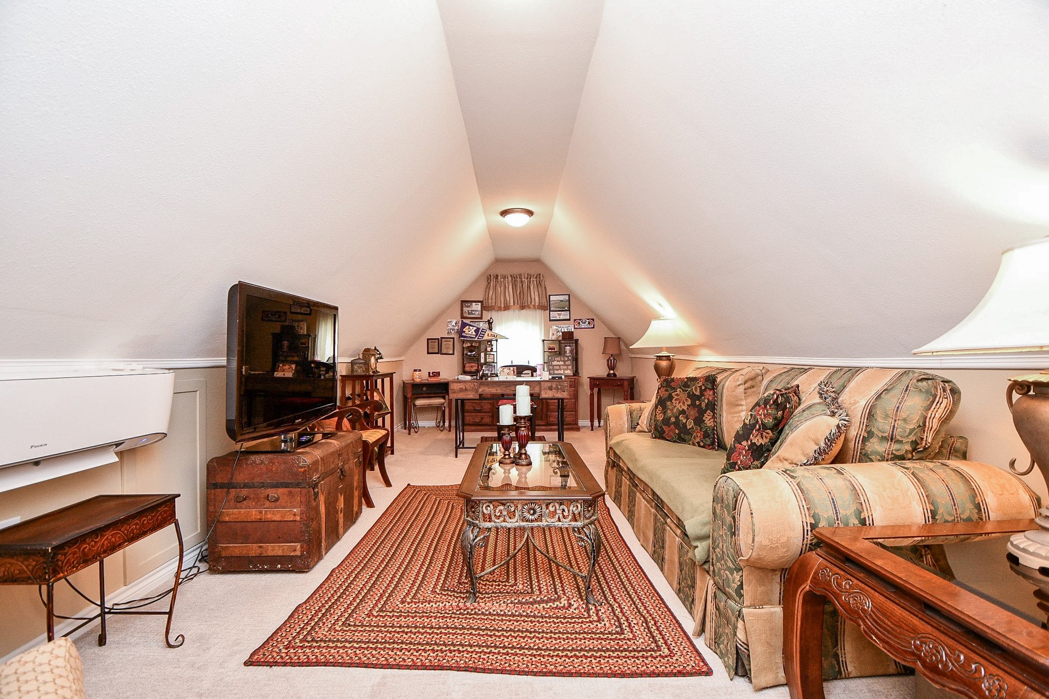 Work from home without sacrificing your personal space! Finished out in 2023, this upstairs bonus room features its own mini-split A/C and offers the perfect setting for a private office, creative studio or comfortable retreat away from the main living areas.
