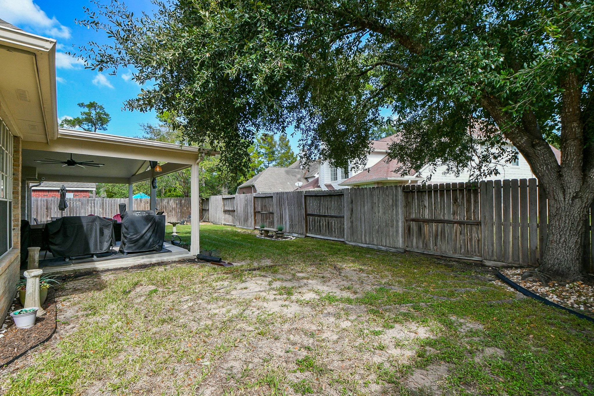 There's room here to make the backyard your own. Picture a garden filled with seasonal blooms, a space for outdoor games, or simply a quiet place to enjoy the shade beneath the mature trees.