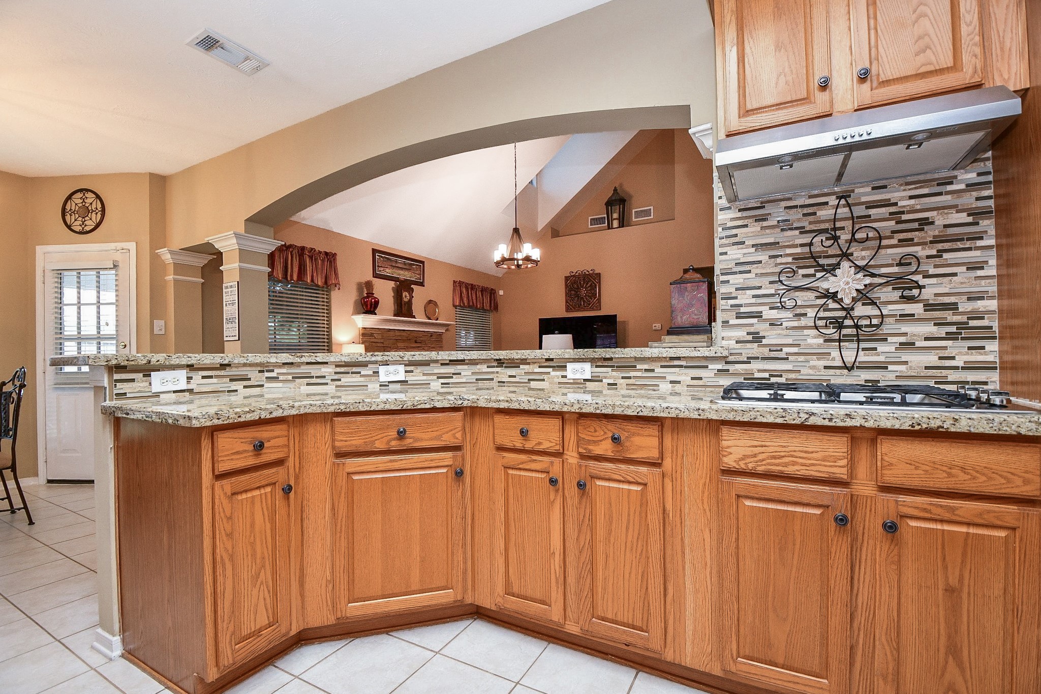The kitchen may be where the cooking happens, but it's also where everyone loves to gather! An open pass-through connects the kitchen to the family room, keeping conversation flowing and making entertaining feel effortless.