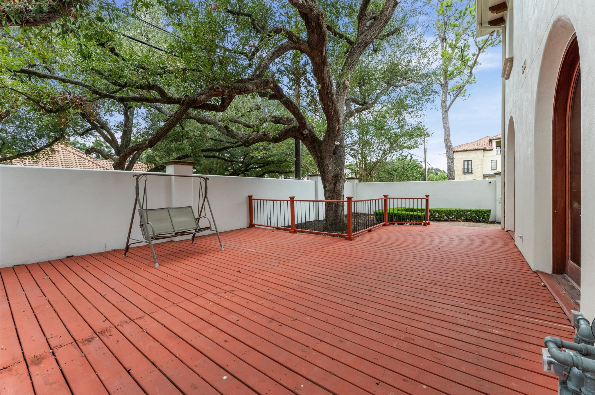 Extend your entertaining outdoors to this elevated side deck, conveniently accessed from the double living room and family room. An inviting space to enjoy morning coffee, unwind in the fresh air, or gather with guests while embracing the home's exceptional indoor-outdoor living.