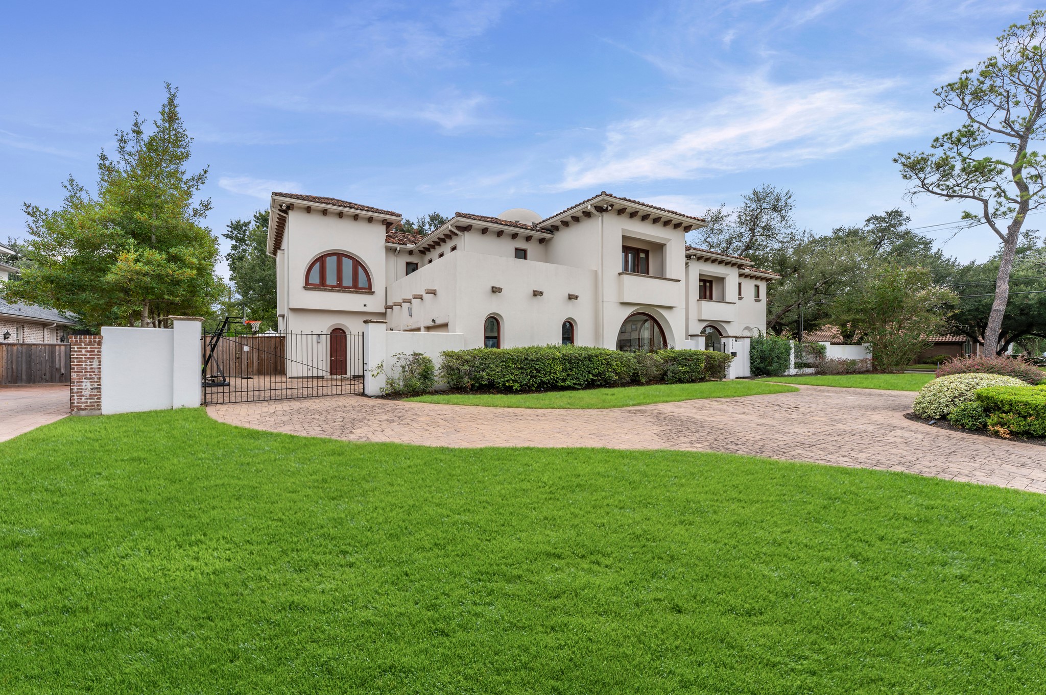 Arrive through a gated driveway offering added privacy and access to the three-car garage. Set on a generous lot with refined architectural details and impressive curb appeal, this exceptional estate offers a distinguished sense of arrival.