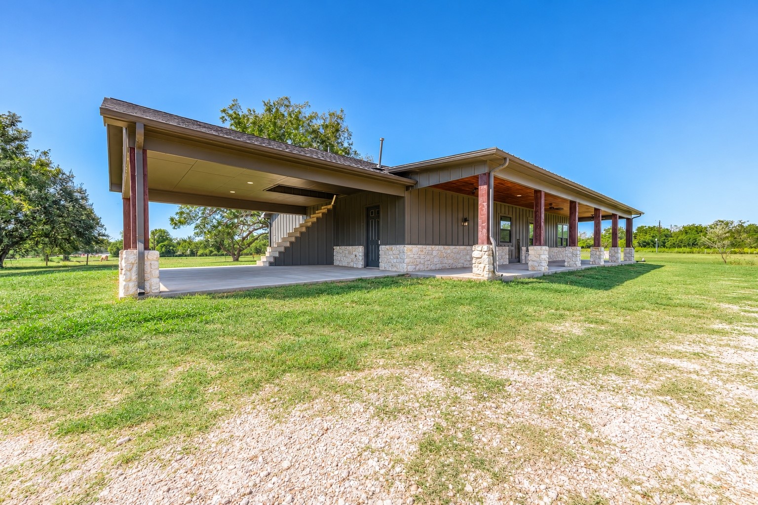 Large covered outdoor area and carport for shaded parking, equipment or entertaining. This photo may be edited using AI tools.