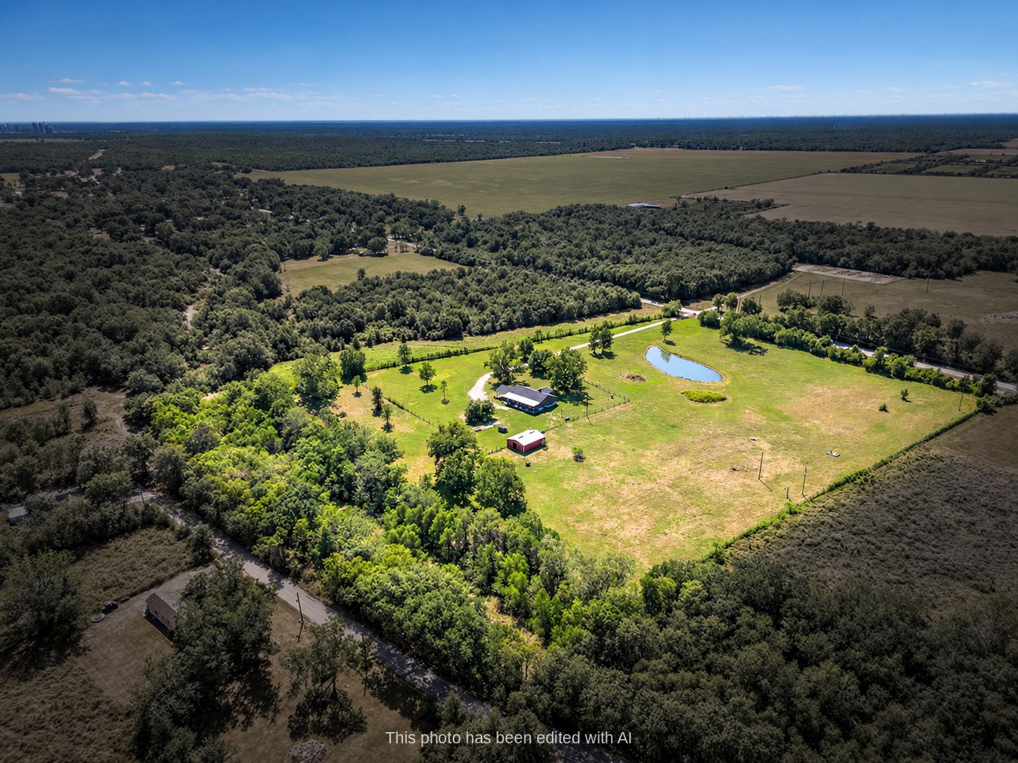 Aerial view of 3295 FM 524 in Sweeny, TX: a 15.9-acre country home property in Brazoria County with open pasture, mature trees and approximate property lines highlighted. This photo may be edited using AI tools. Aerial view of 3295 FM 524 in Sweeny, TX: a 15.9-acre country home property in Brazoria County with open pasture, mature trees and approximate property lines highlighted. This photo may be edited using AI tools.